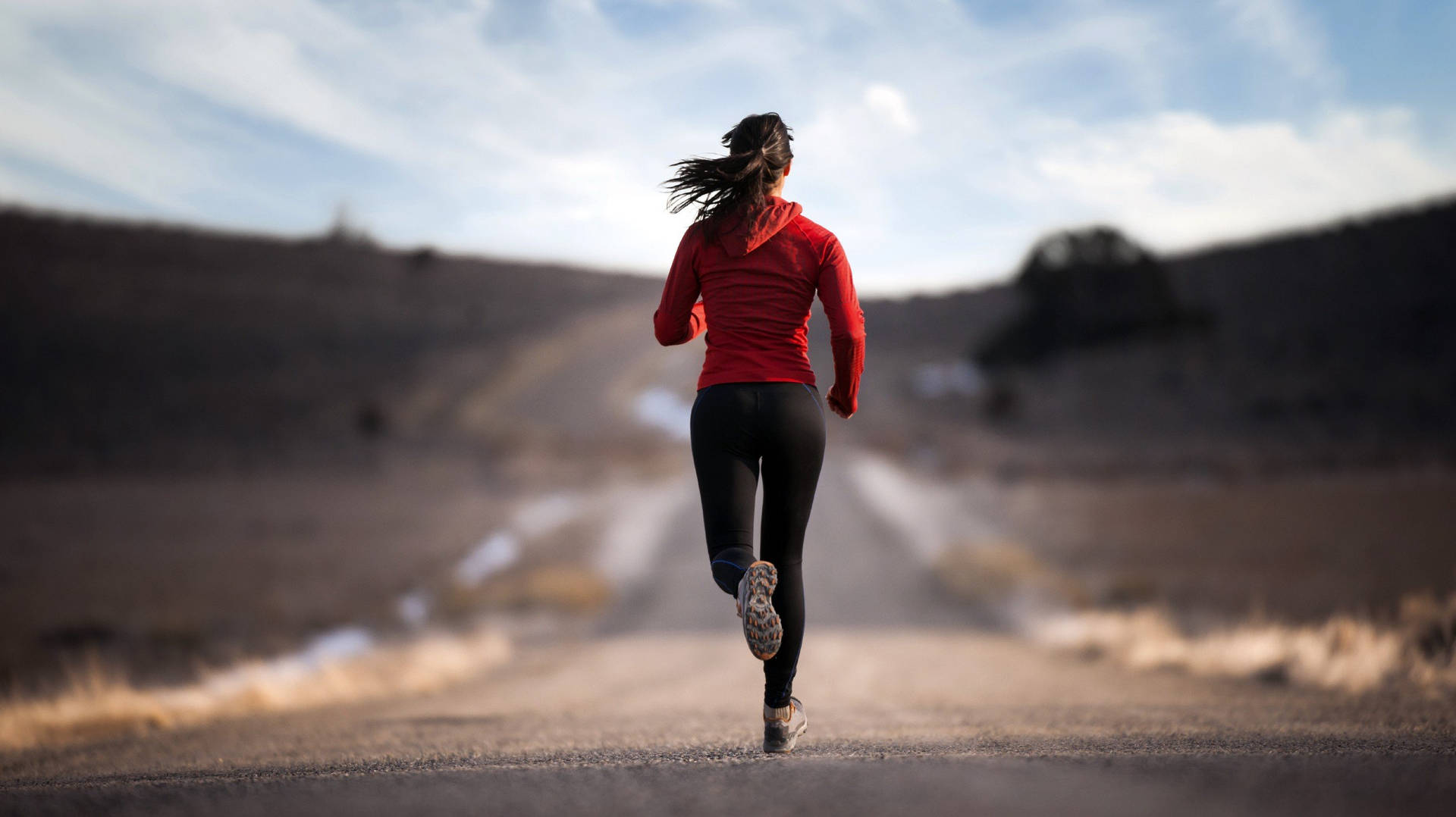 Focus Running Woman In Road Wallpaper