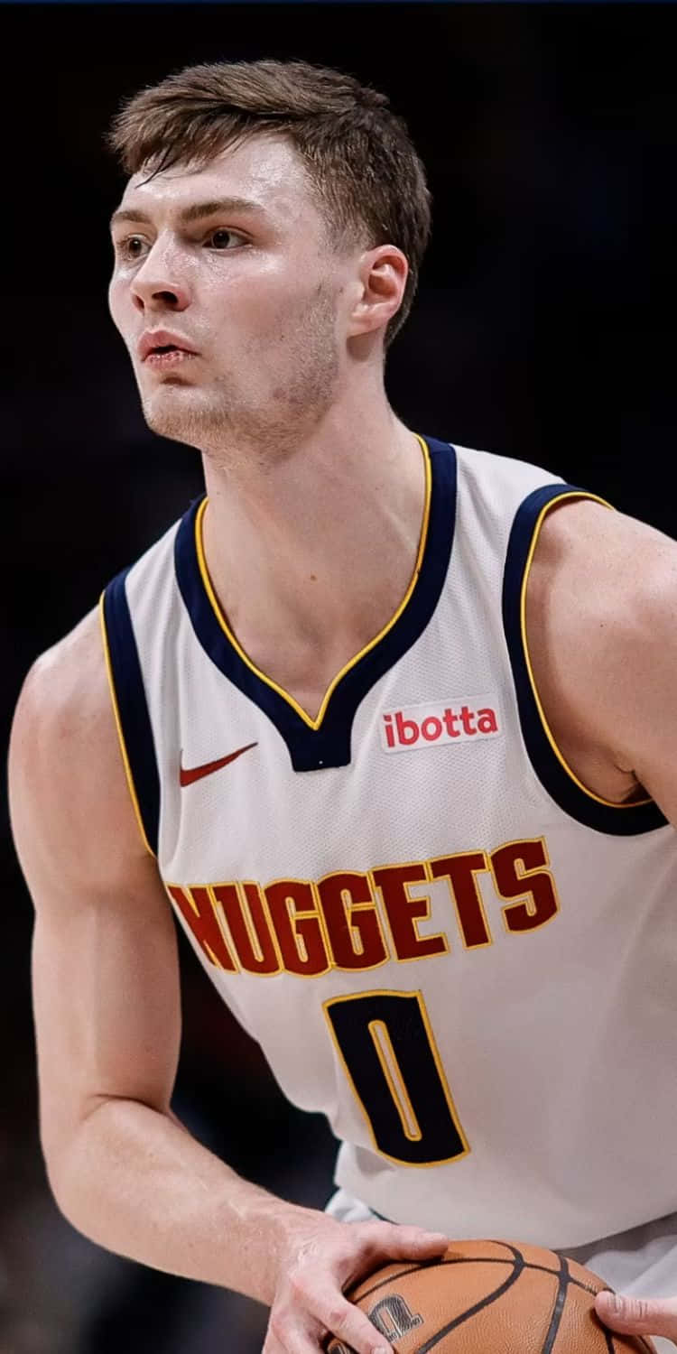 Focused Basketball Player Nuggets Uniform Wallpaper