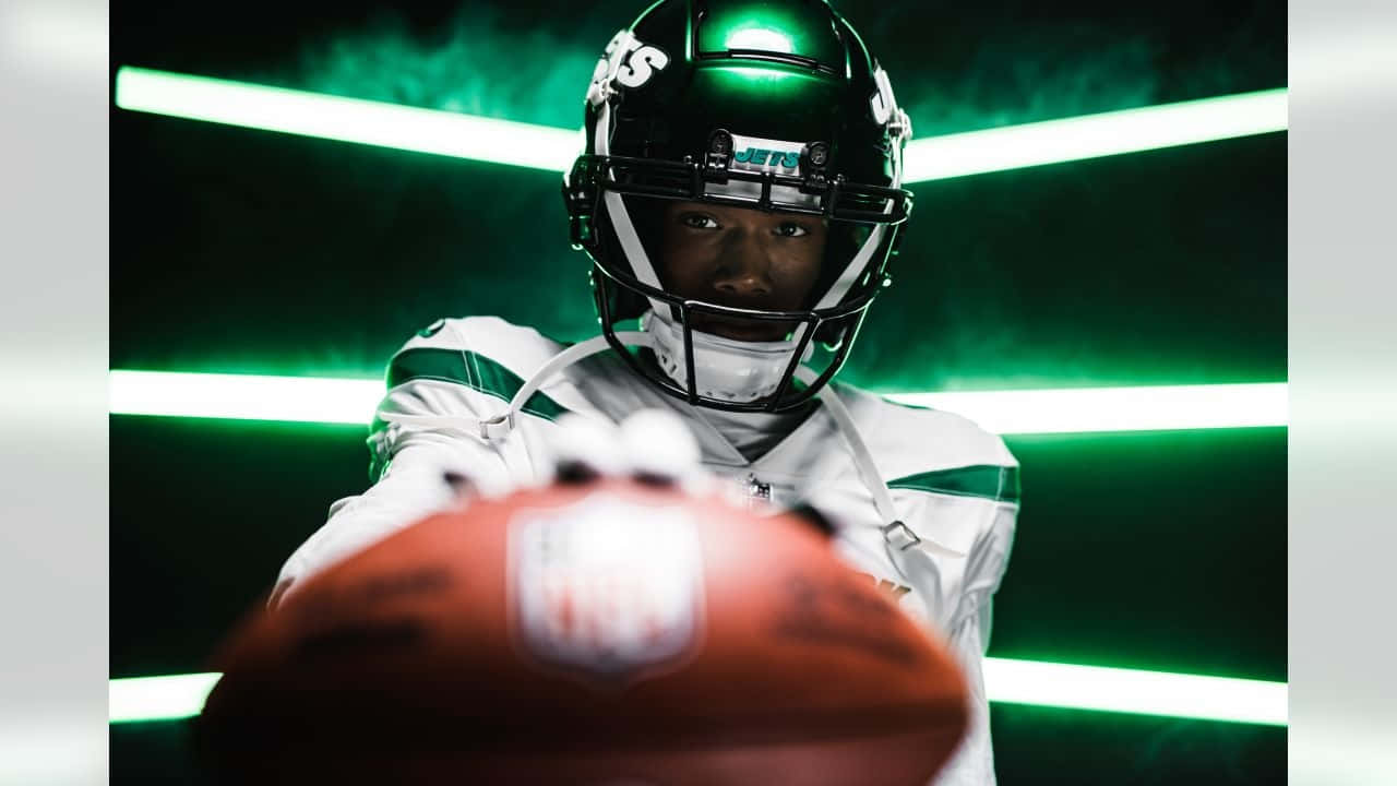 Focused Football Player Green Lights Wallpaper