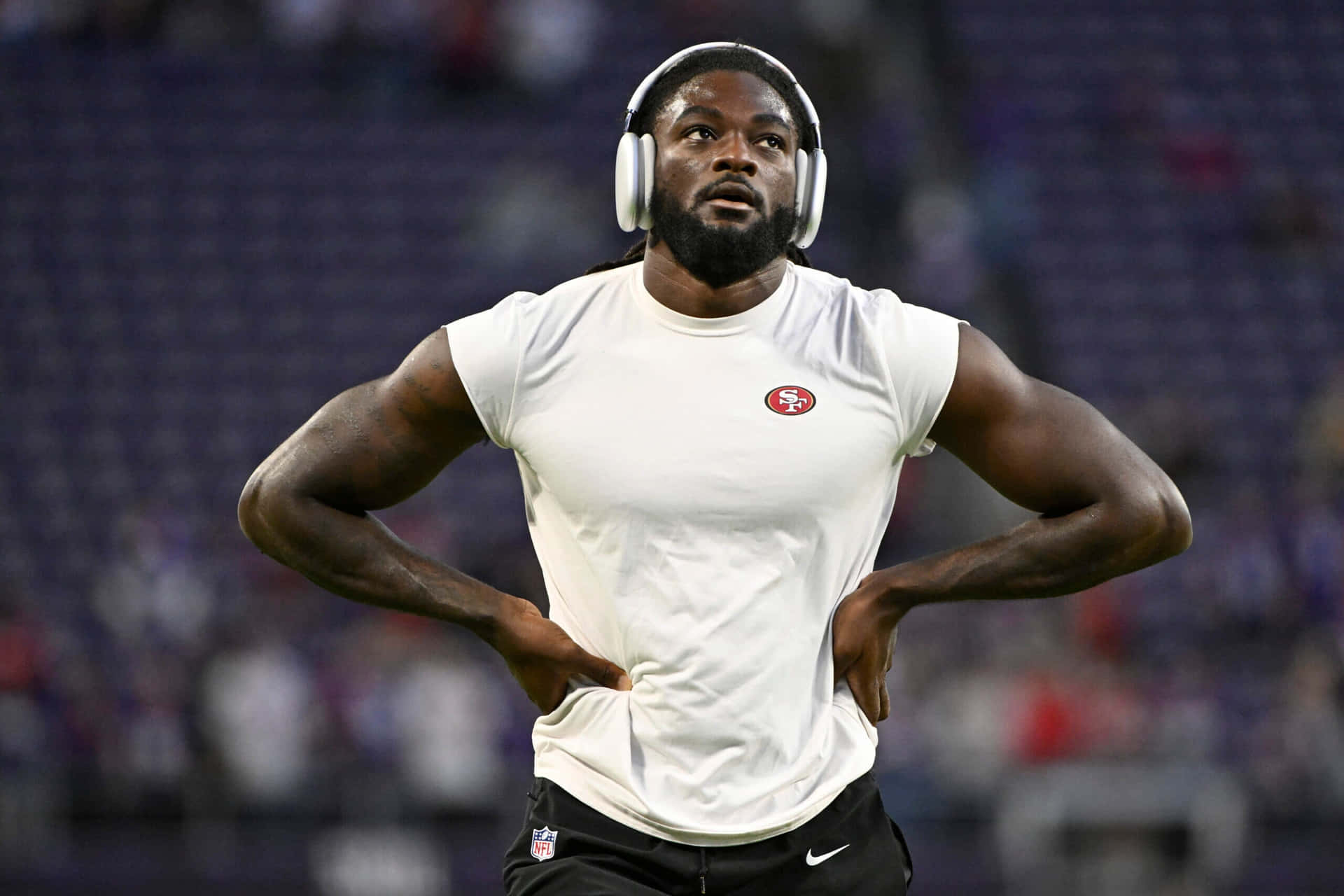 Focused Football Player Warming Up Pre Game Wallpaper