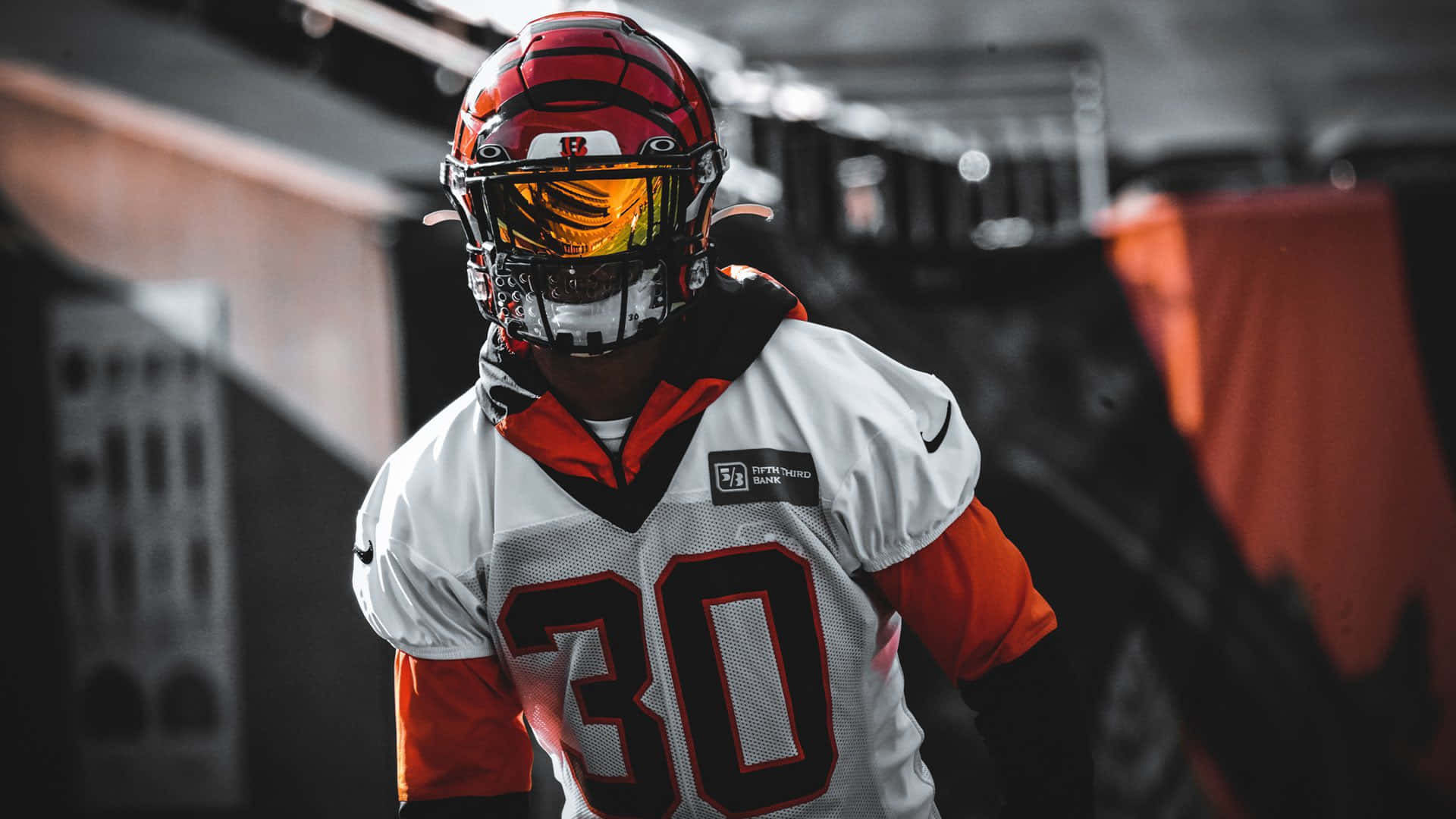 Focused Football Player Wearing Number30 Jersey Wallpaper