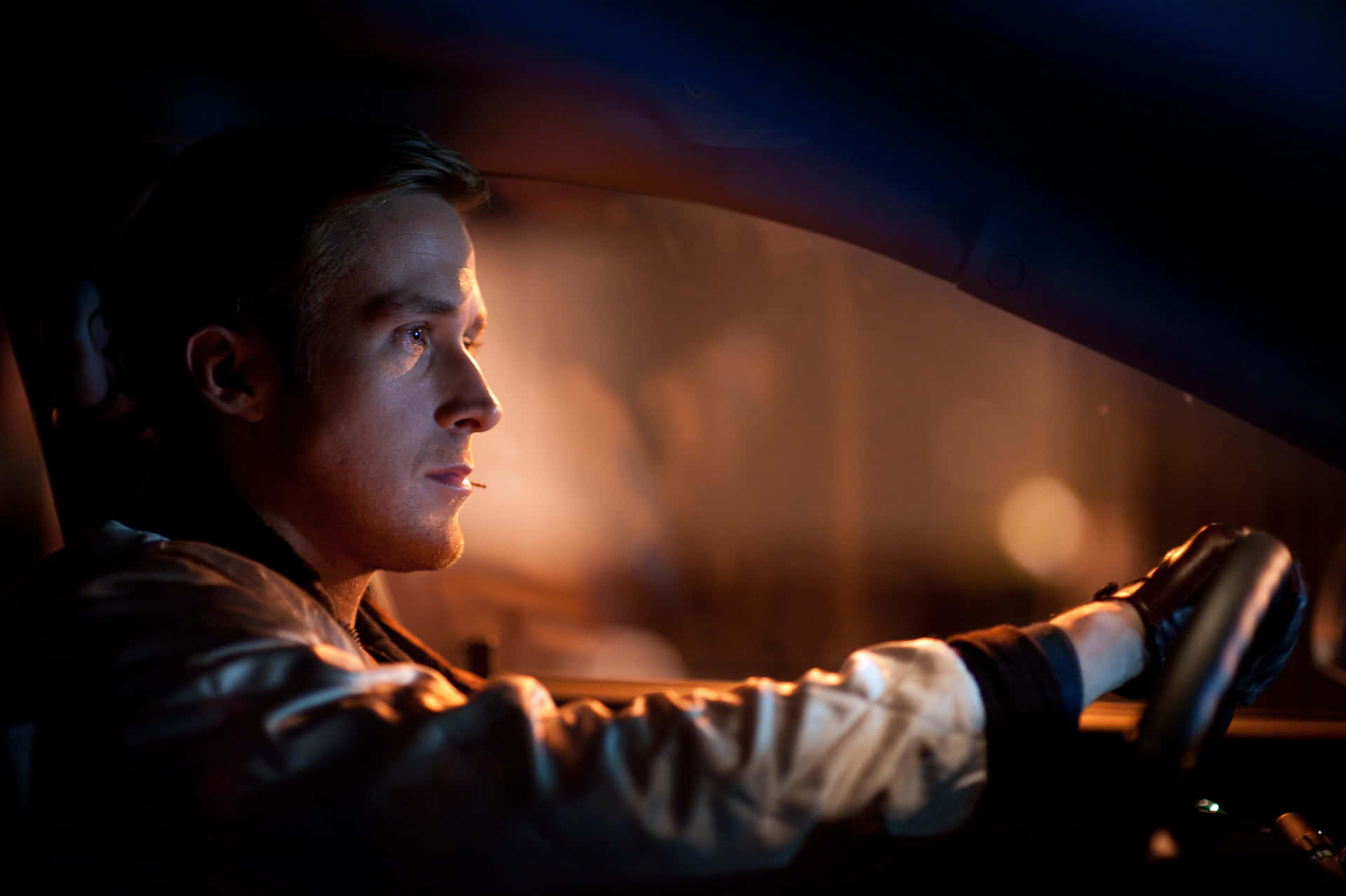 Focused Man Drivingat Night Wallpaper