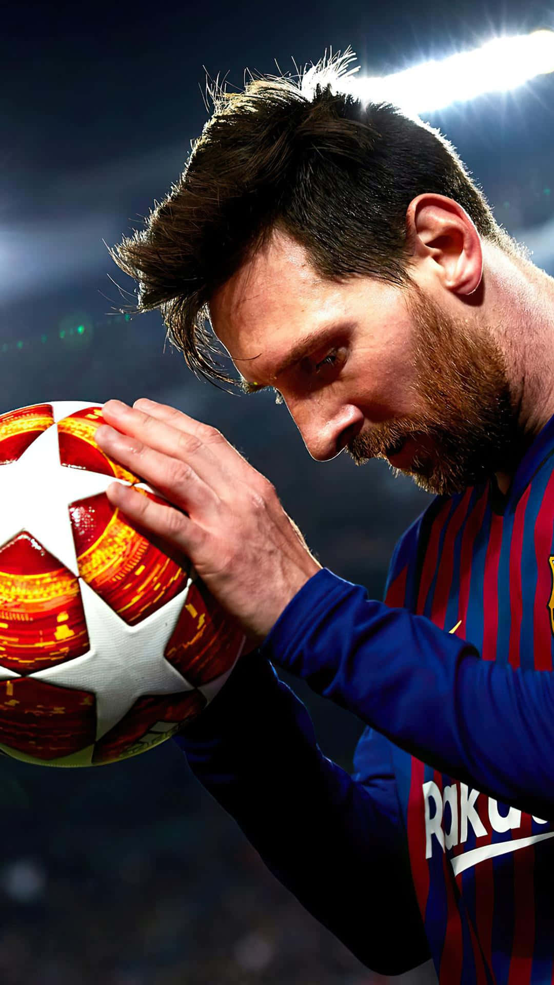 Focused Soccer Player Holding Ball Wallpaper