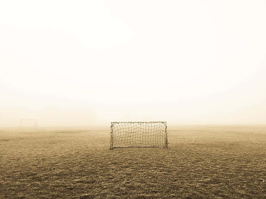 Mistige Voetbalveld Met Doelen.jpg Achtergrond