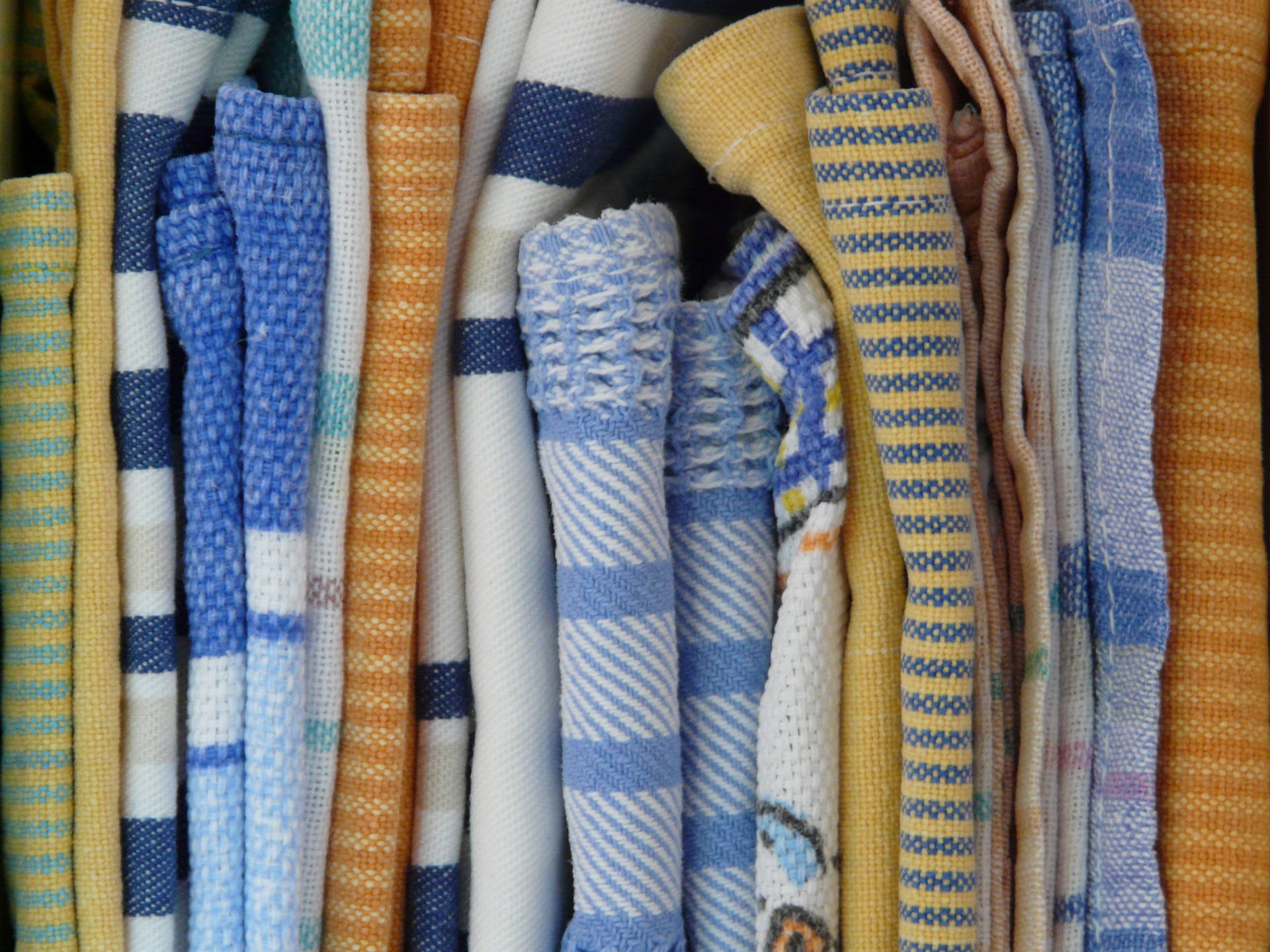 Folded Clothes With Prints Close-up Background