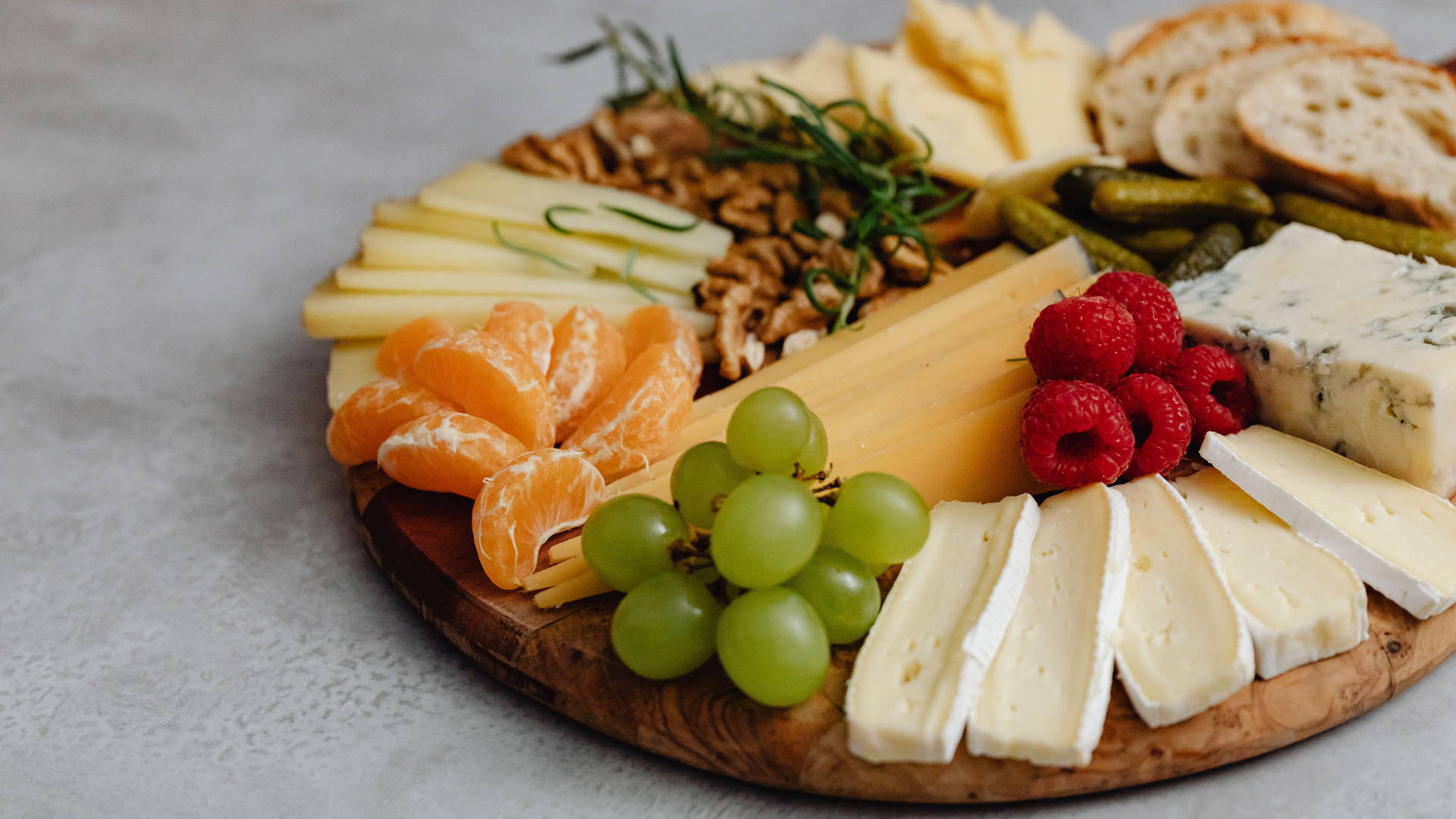 A Platter Of Cheese, Fruit, And Nuts Wallpaper