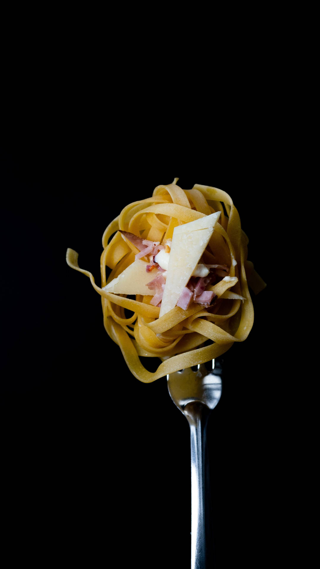 En gaffel med pasta på den Wallpaper