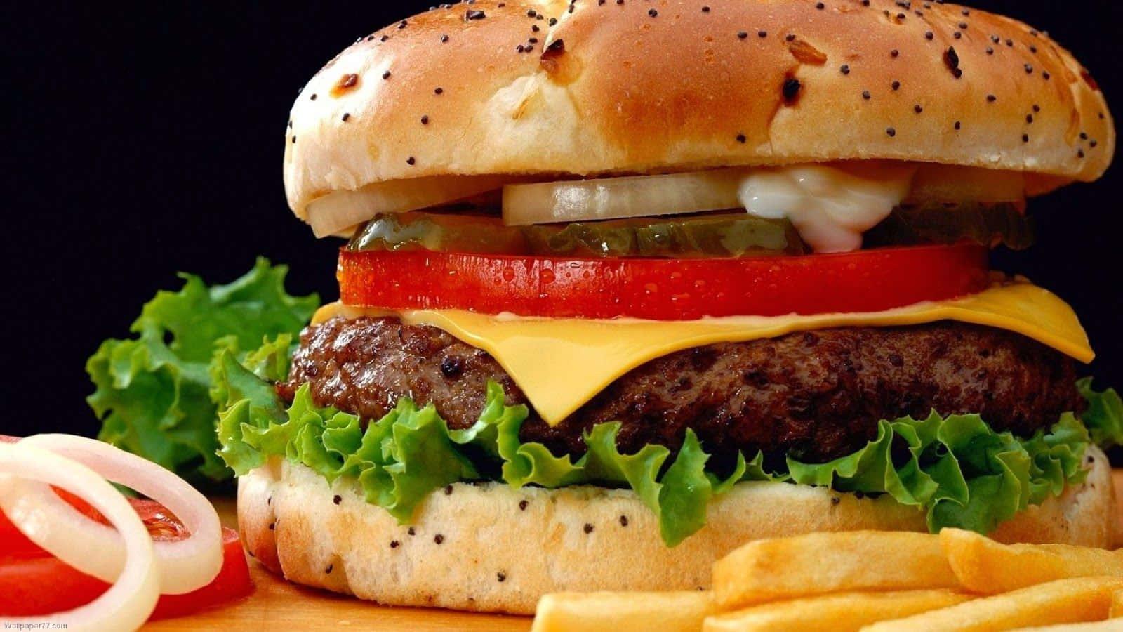 Delicious Fast Food Cheeseburger With Fries Background