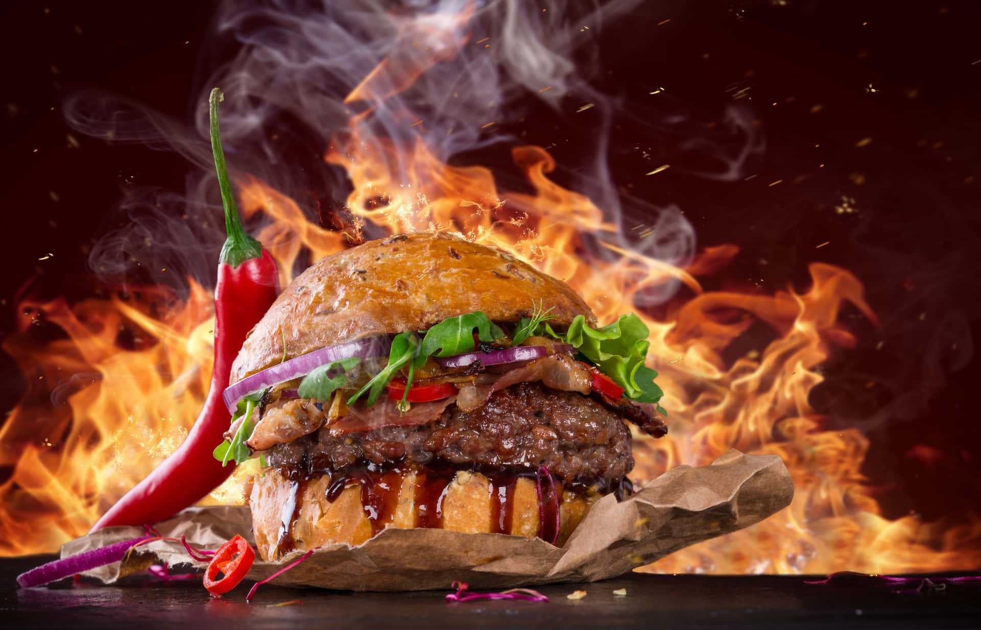A Burger On Fire With Chili Peppers