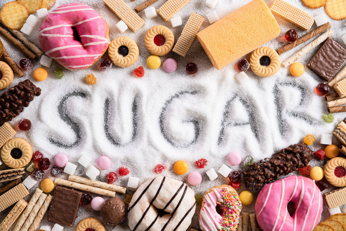 Assorted high-sugar foods on display Wallpaper