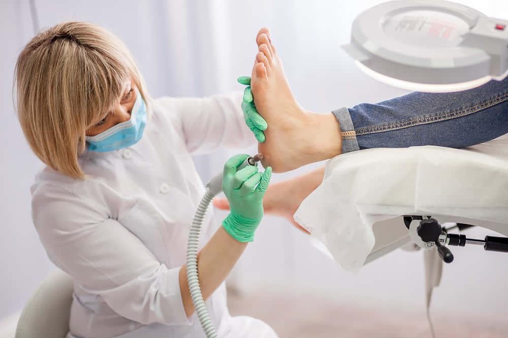 Bildeiner Fuß-frauen-dermatologin