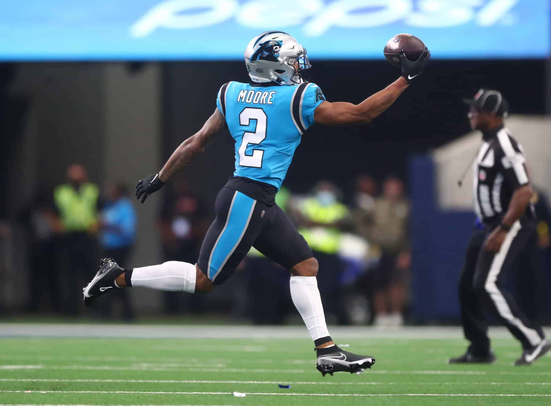 Football Athlete Dj Moore Of Carolina Panthers Catching The Ball Wallpaper