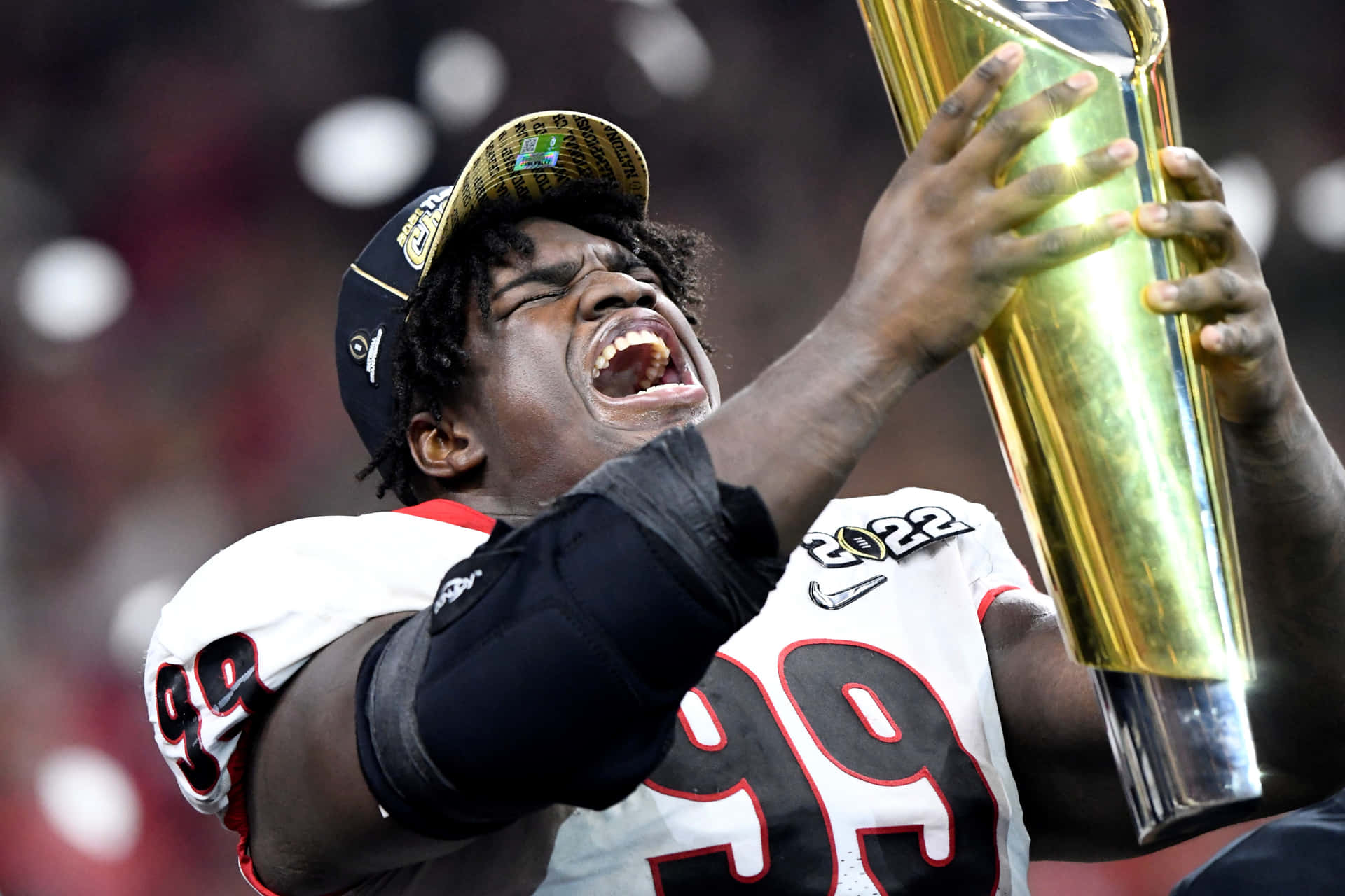 Football Player Celebratingwith Trophy2022 Wallpaper