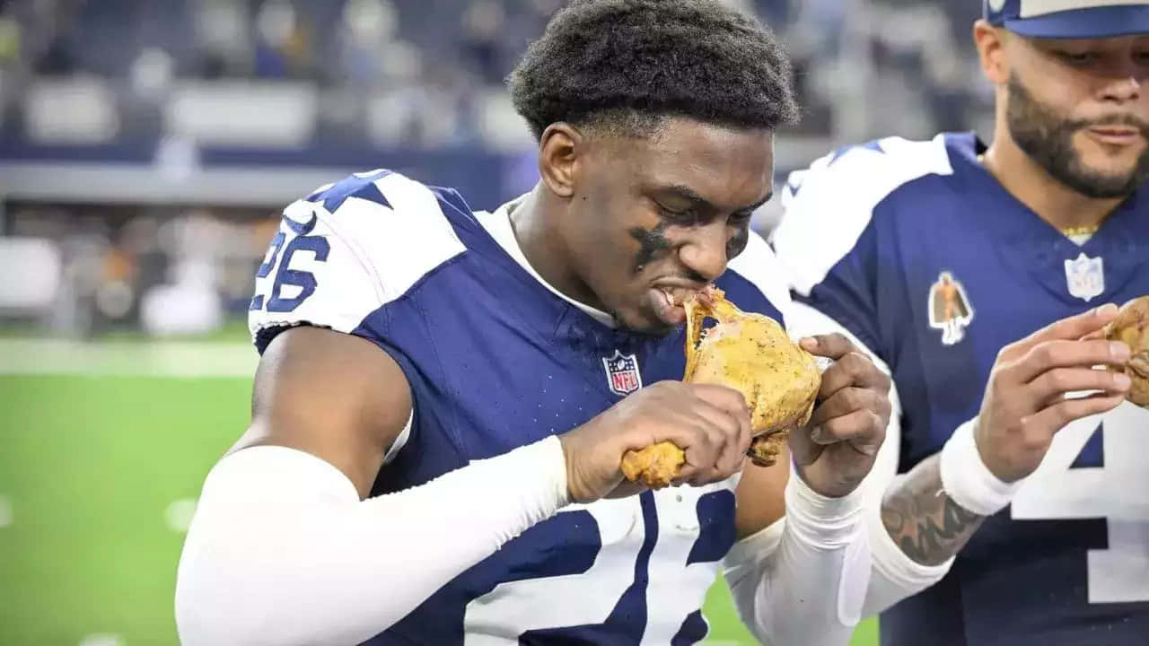 Football Player Eating Turkey Leg Wallpaper