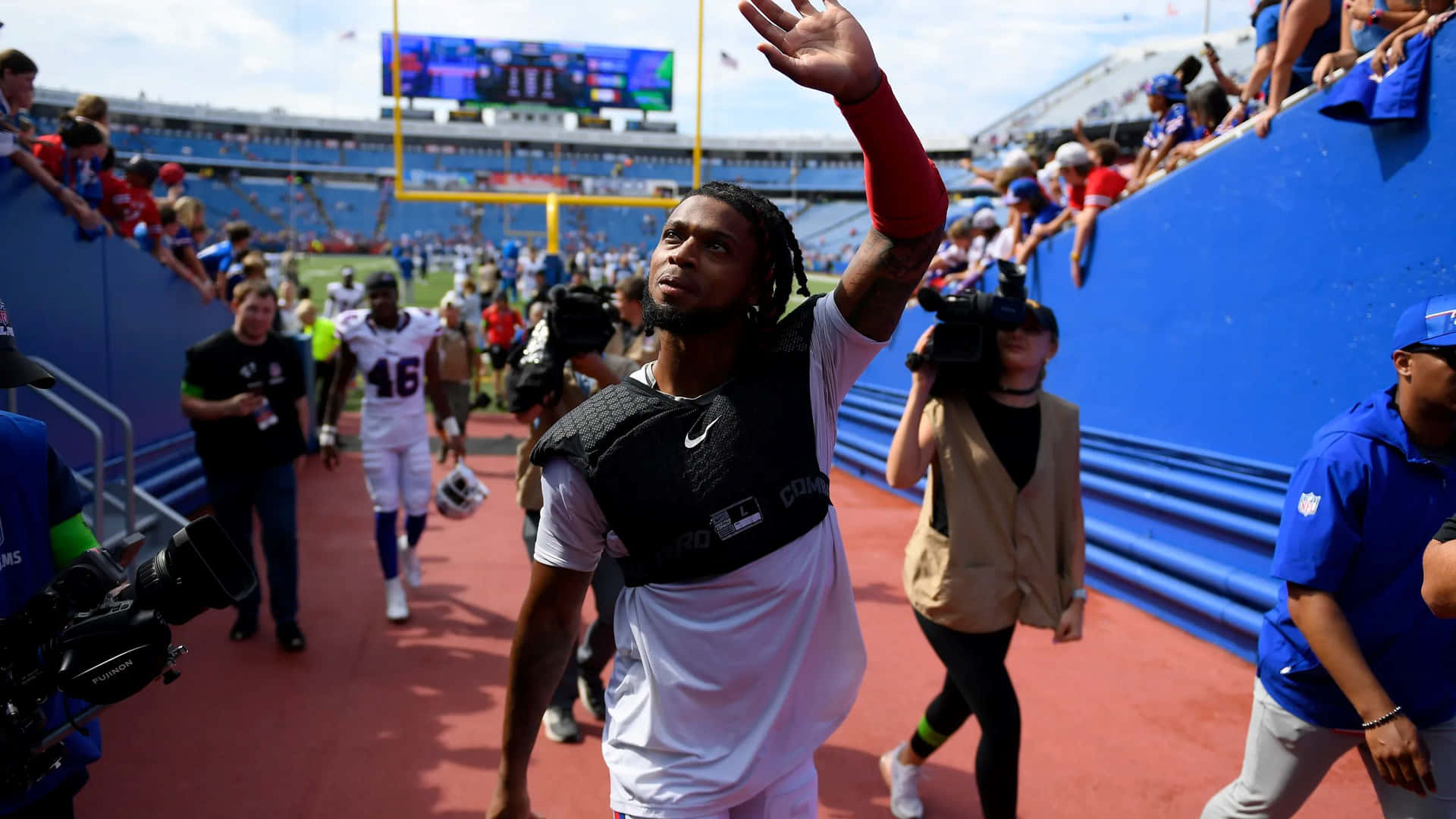 Football Player Greeting Fans Stadium Wallpaper