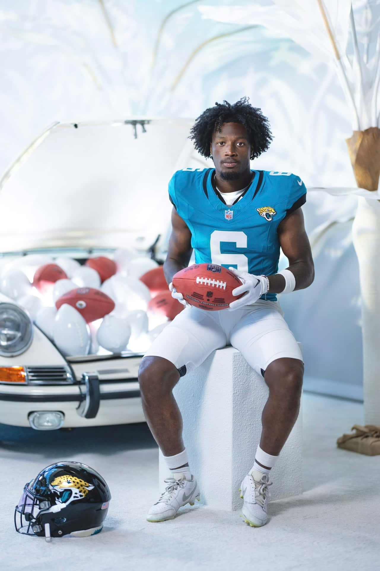 Football_ Player_ Portrait_with_ Helmet_and_ Car_ Background Wallpaper