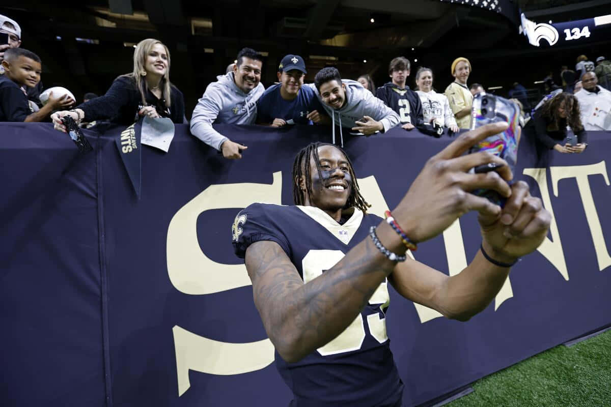 Football Player Selfie With Fans Wallpaper