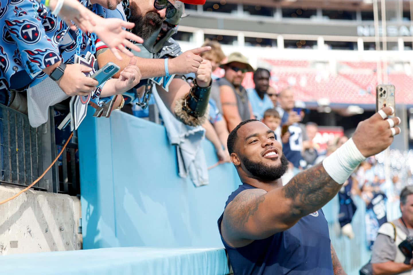 Football Player Selfie With Fans Wallpaper