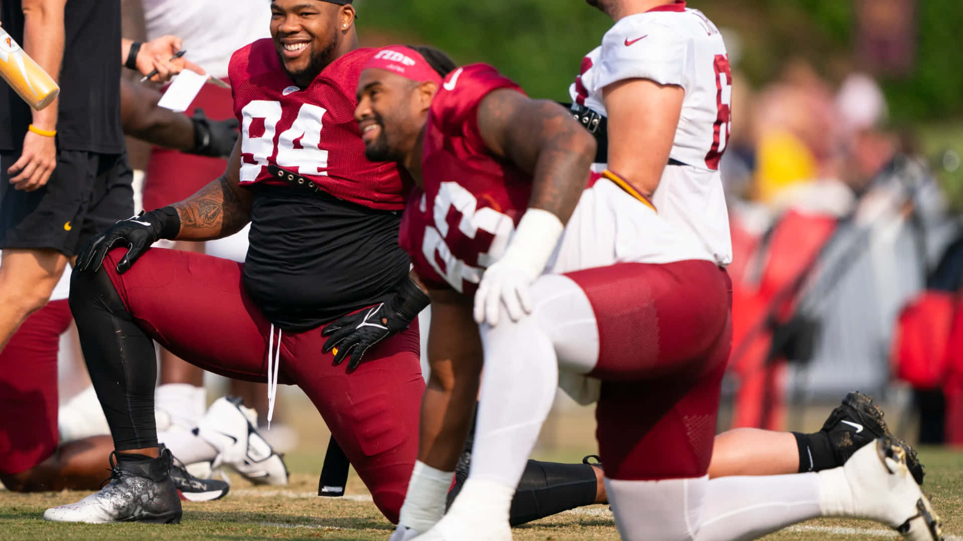 Football Players Laughing During Training Wallpaper