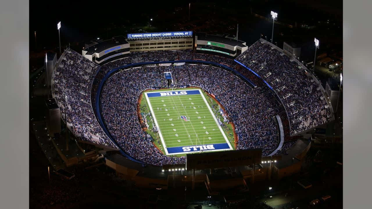 a stadium with lights on at night