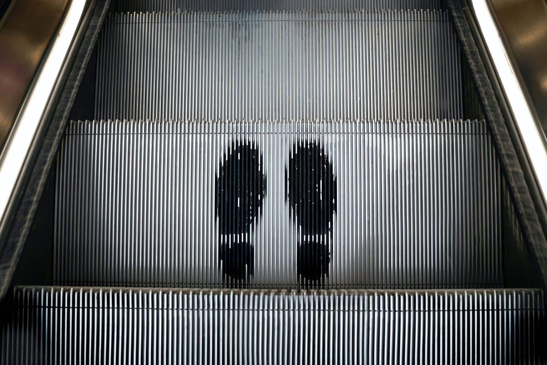 Footprints On Automatic Escalator Wallpaper
