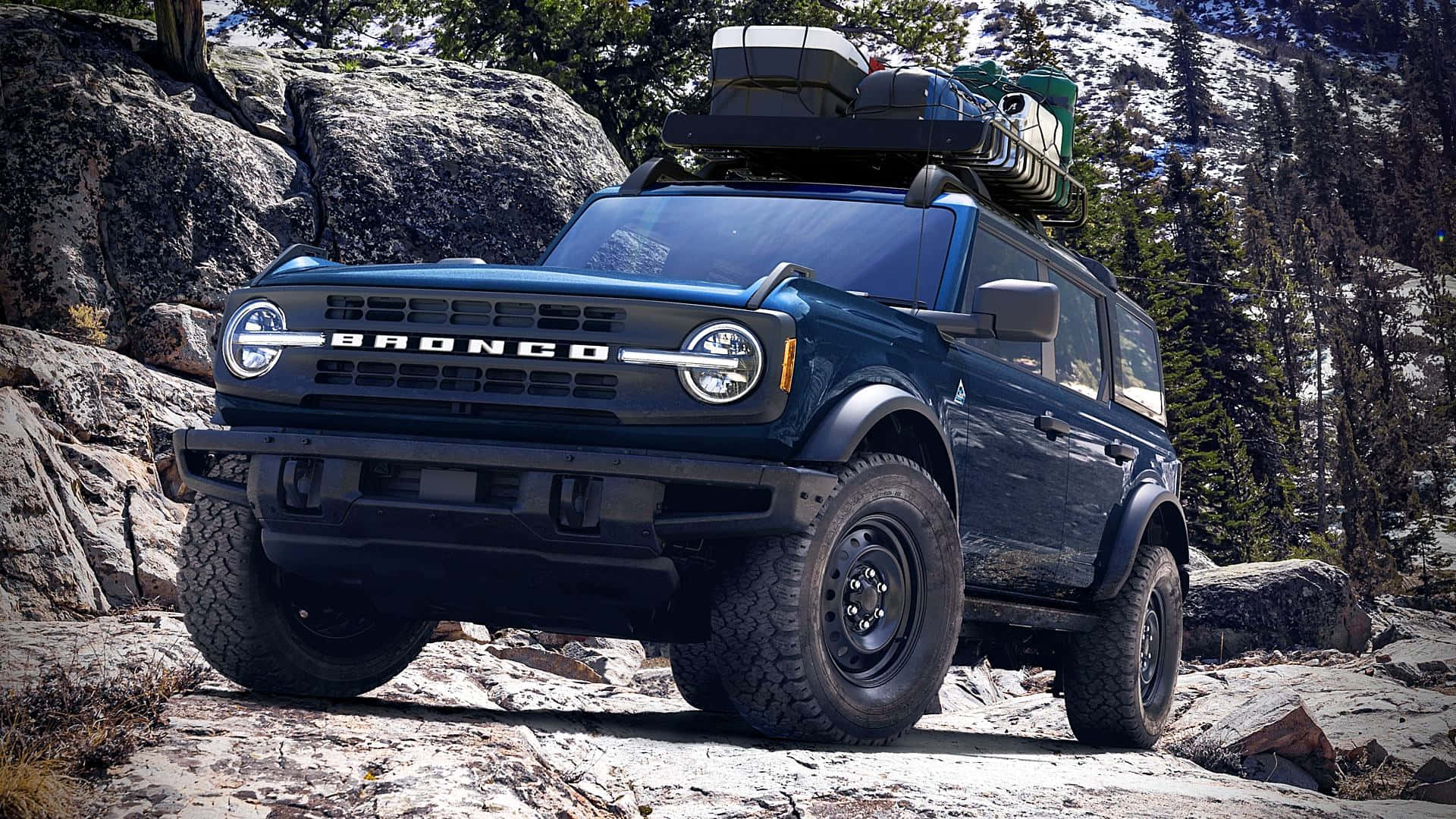 The 2020 Ford Bronco Is Driving Down A Rocky Mountain Road