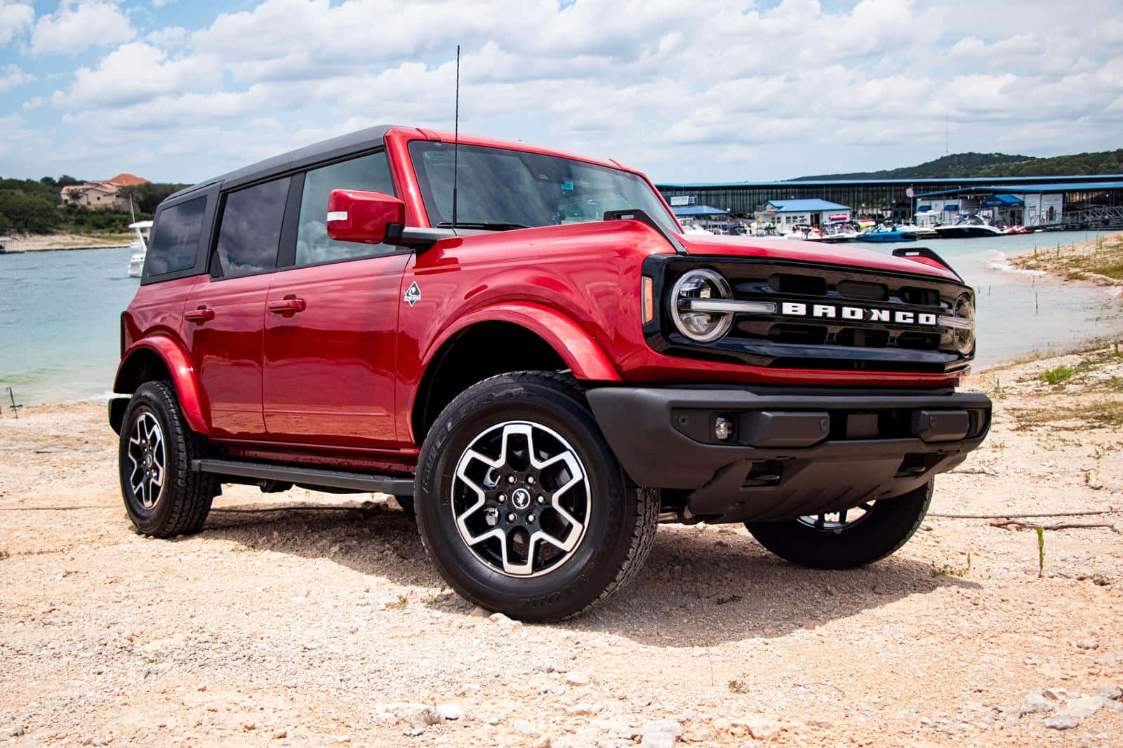 The Red 2020 Ford Bronco Is Parked On The Shore