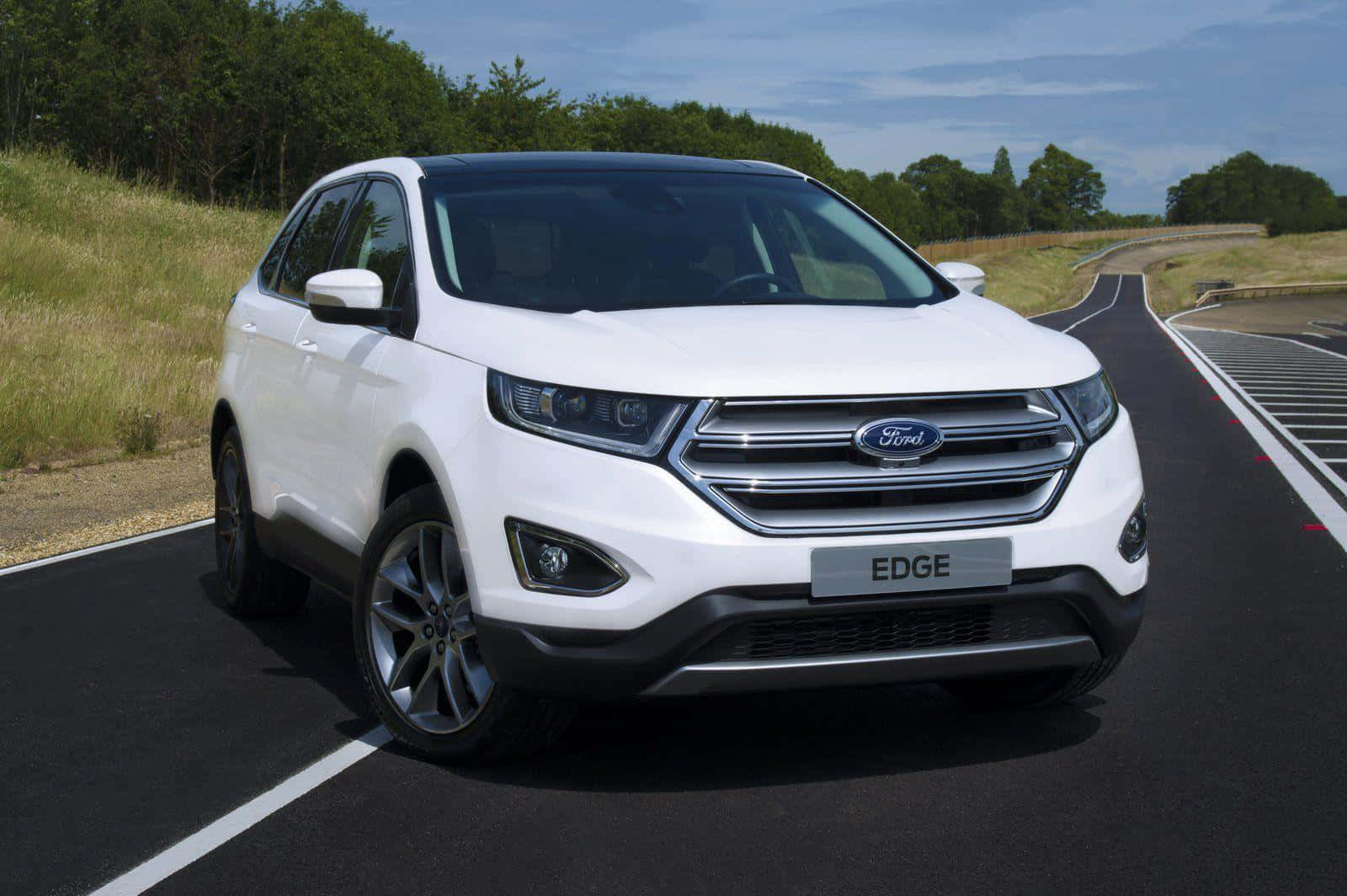 Sleek Ford Edge on a scenic drive Wallpaper