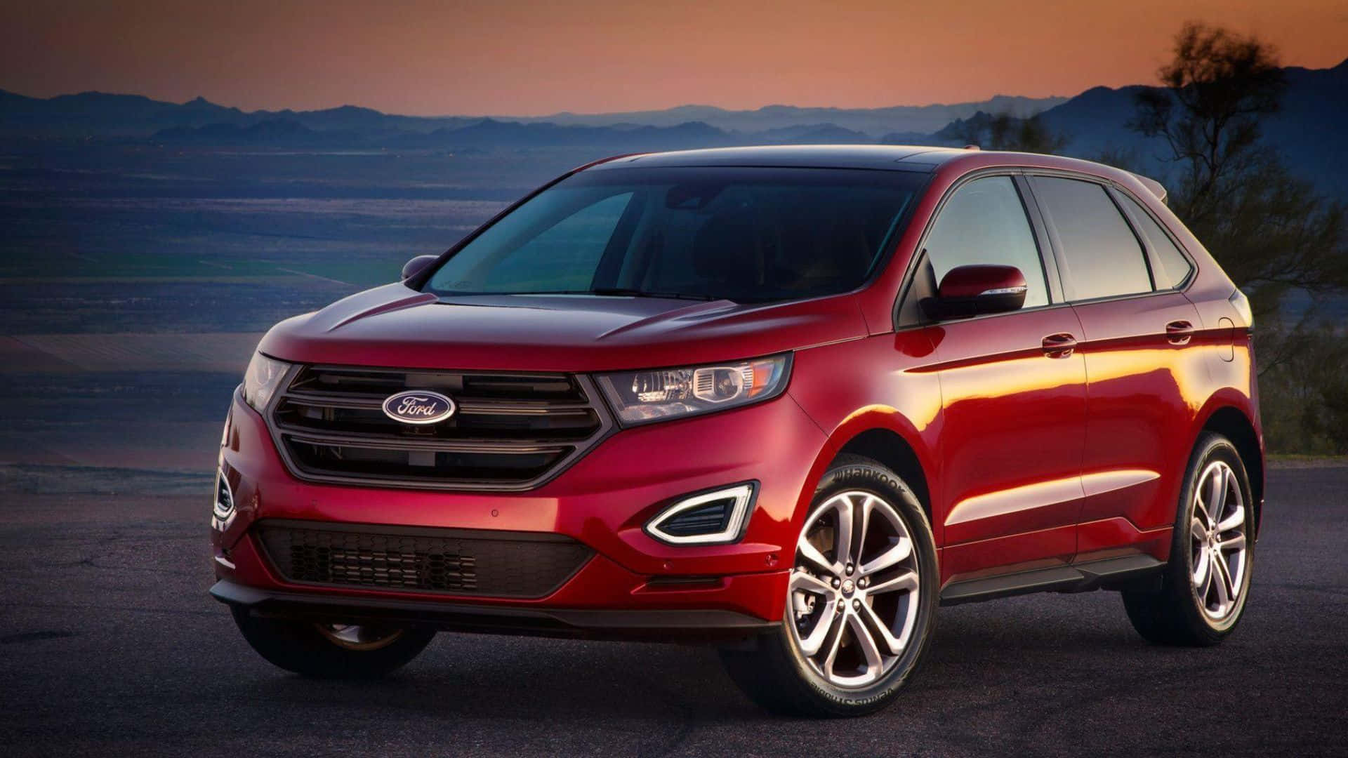 The Sleek and Stylish Ford Edge SUV Driving On a Scenic Route Wallpaper