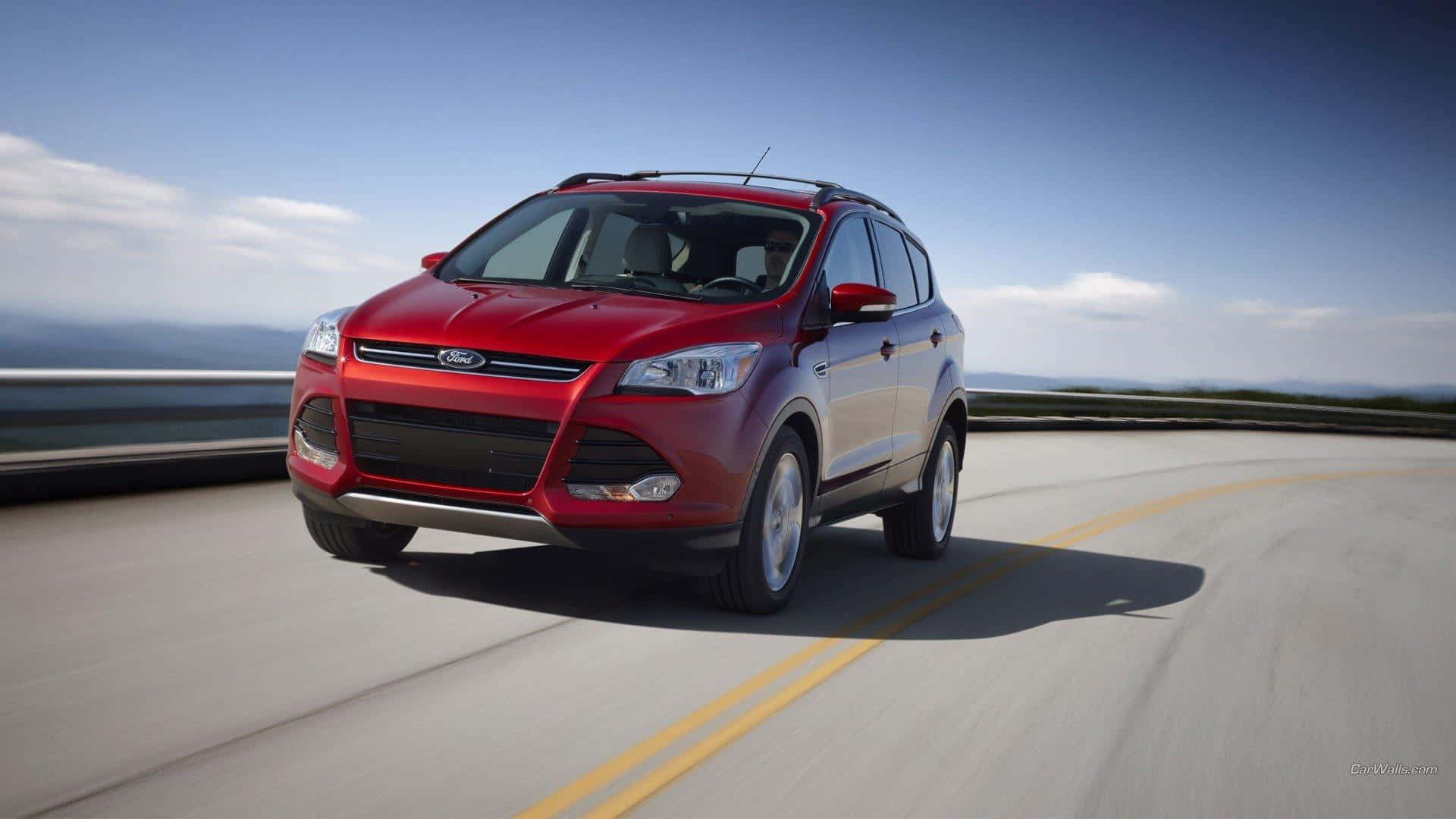 Ford Escape on a Picturesque Mountain Road Wallpaper