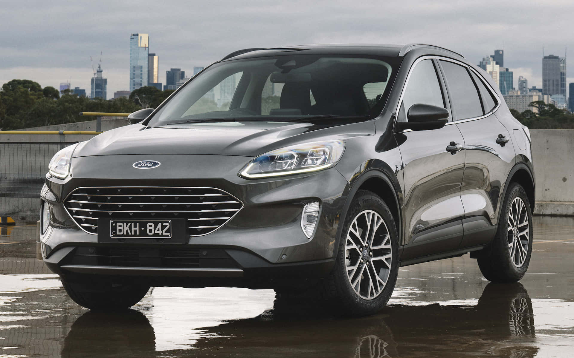 Sleek Ford Escape on a Picturesque Highway Wallpaper