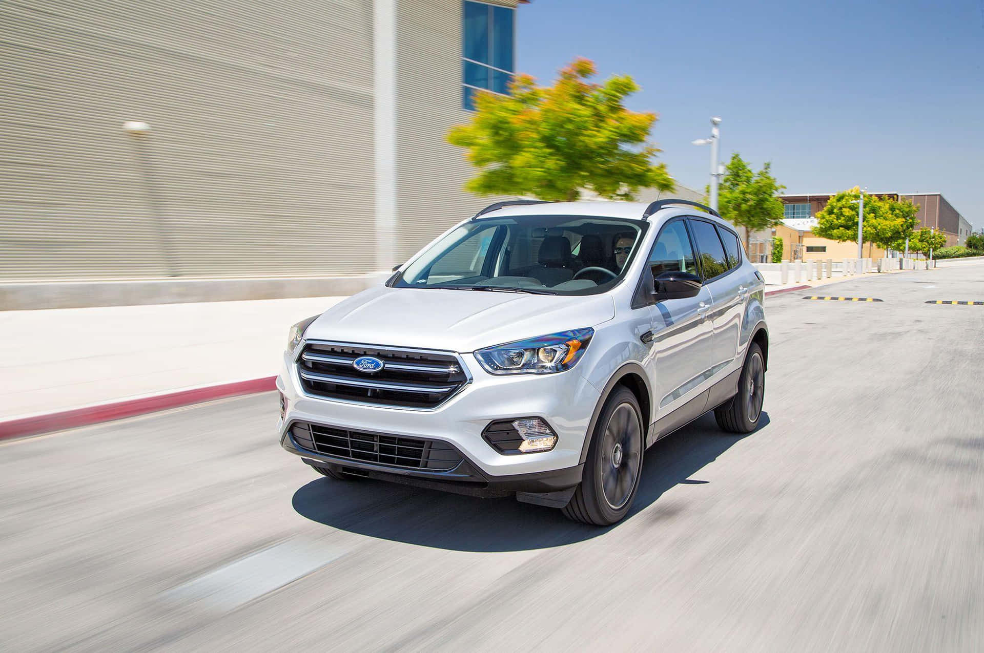 Sleek Ford Escape gliding down the road Wallpaper