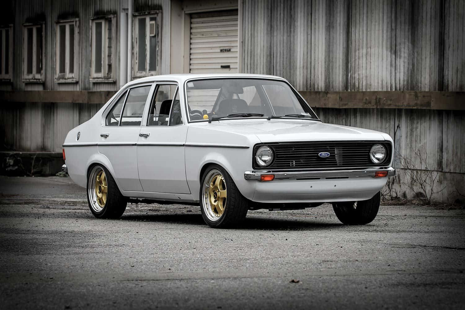Classic Ford Escort on the Road Wallpaper