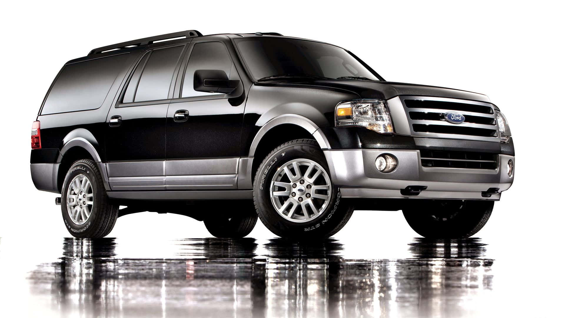 Powerful Ford Expedition traversing the rugged terrain Wallpaper