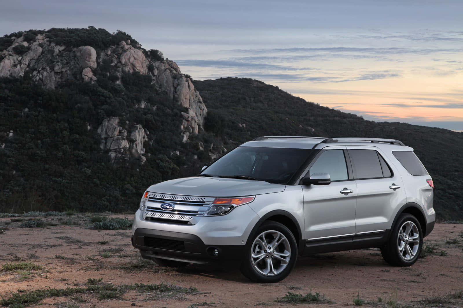 Ford Explorer parked on a scenic route Wallpaper