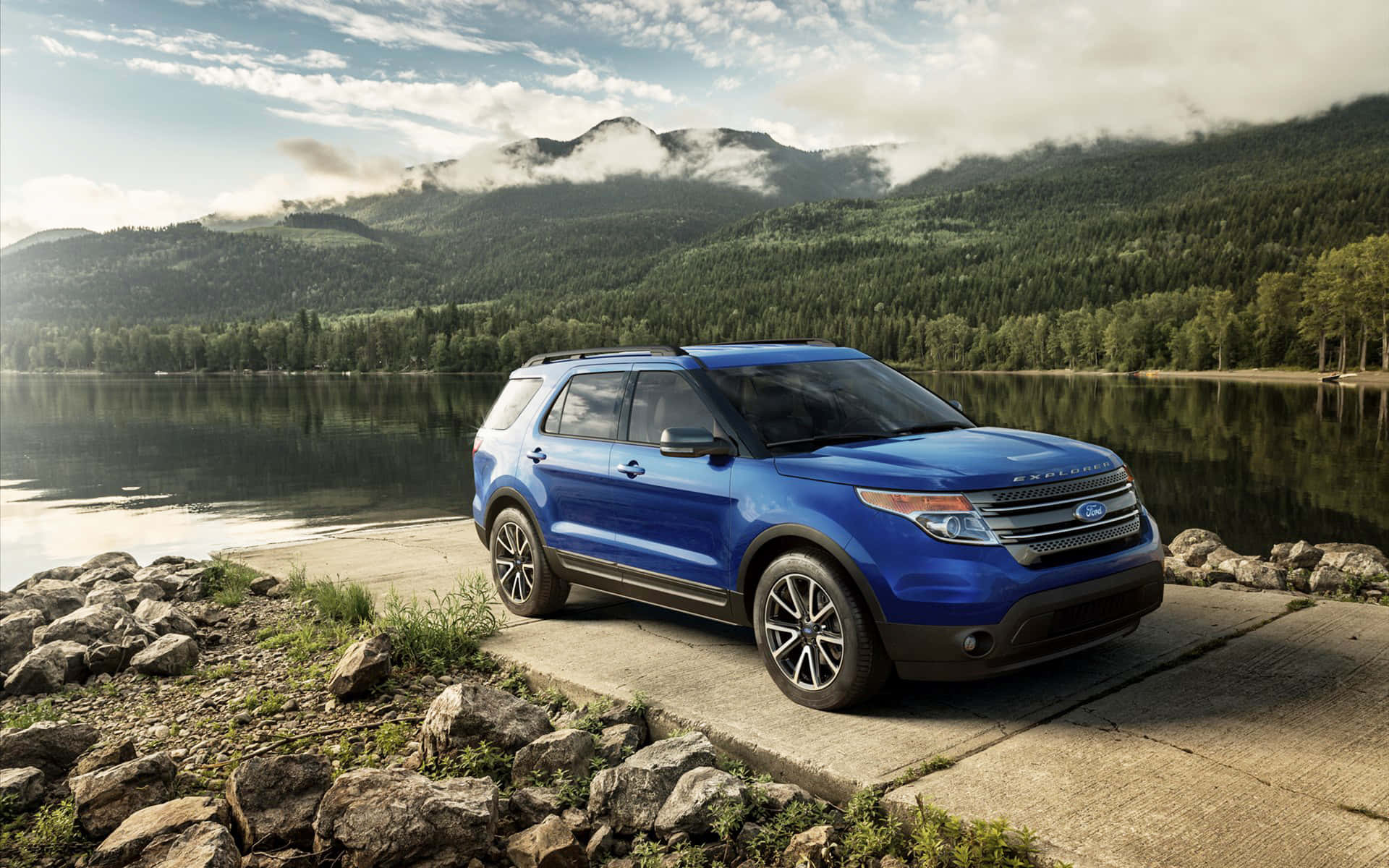 A stunning silver Ford Explorer in a picturesque natural setting Wallpaper