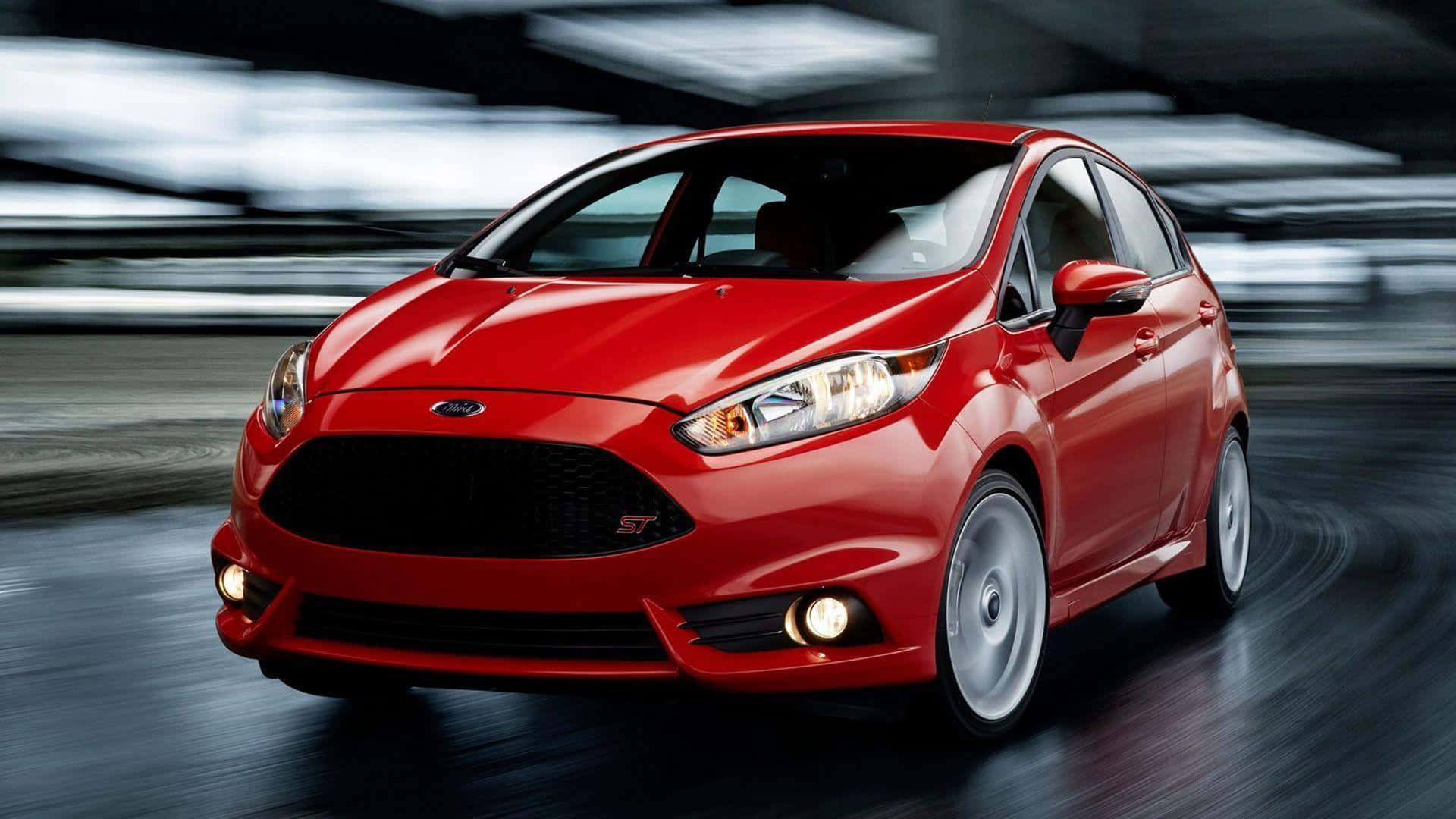 Sleek Red Ford Fiesta on the Go Wallpaper