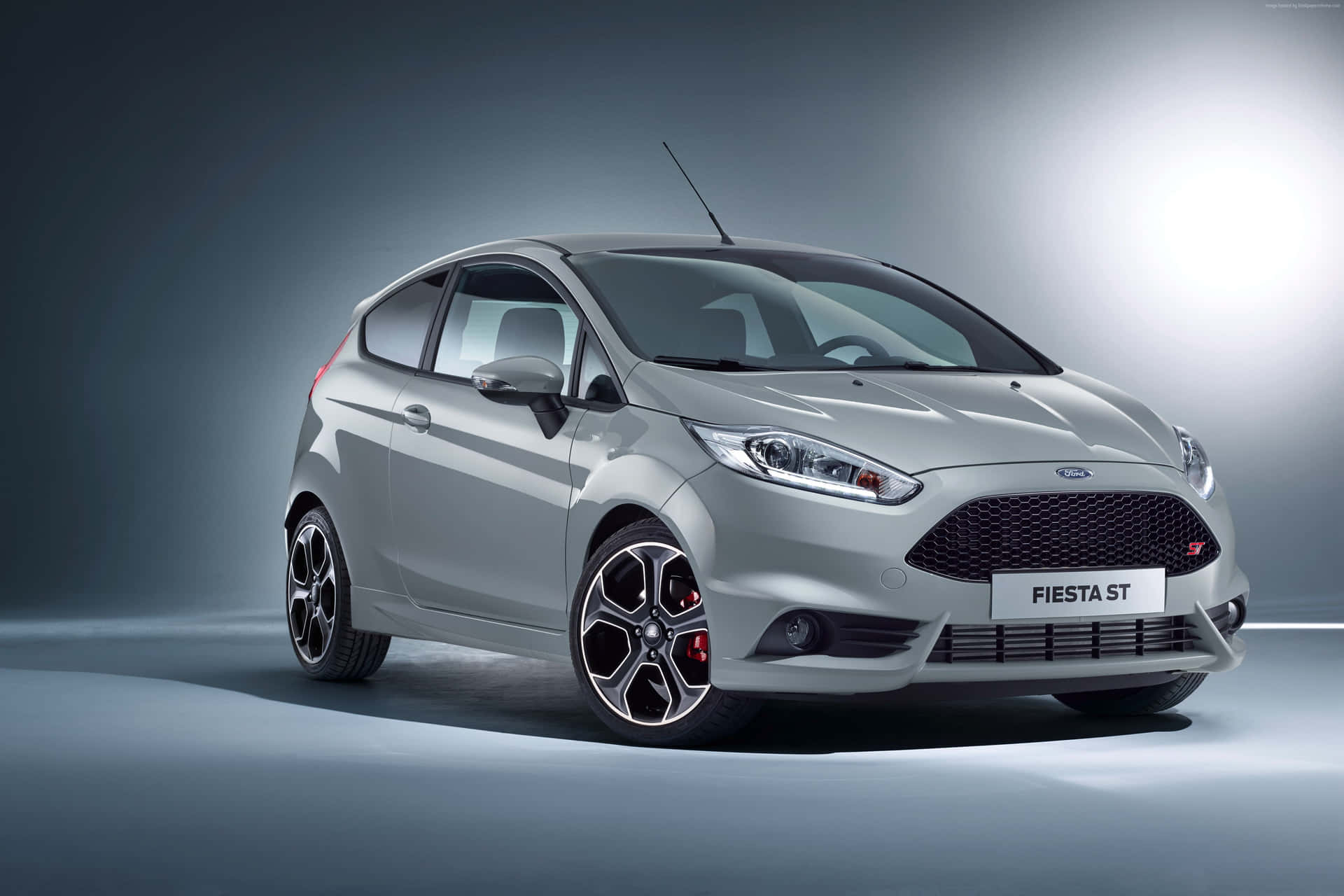 Sleek and Stylish Ford Fiesta on the Road Wallpaper