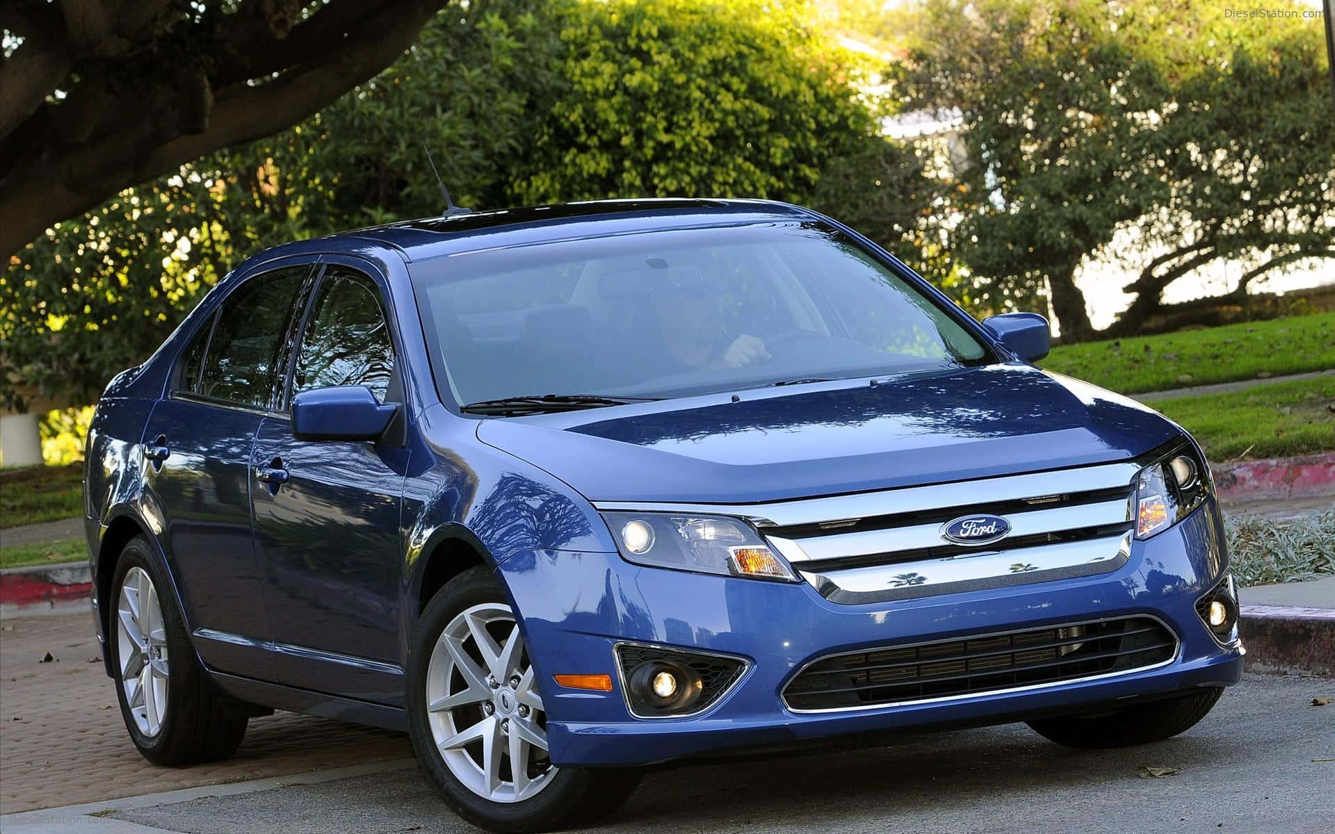 Captivating Ford Fusion With a Stunning Sunset Background Wallpaper