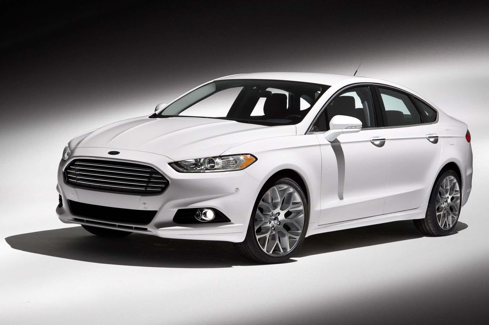 Sleek Ford Fusion cruising on the open road. Wallpaper