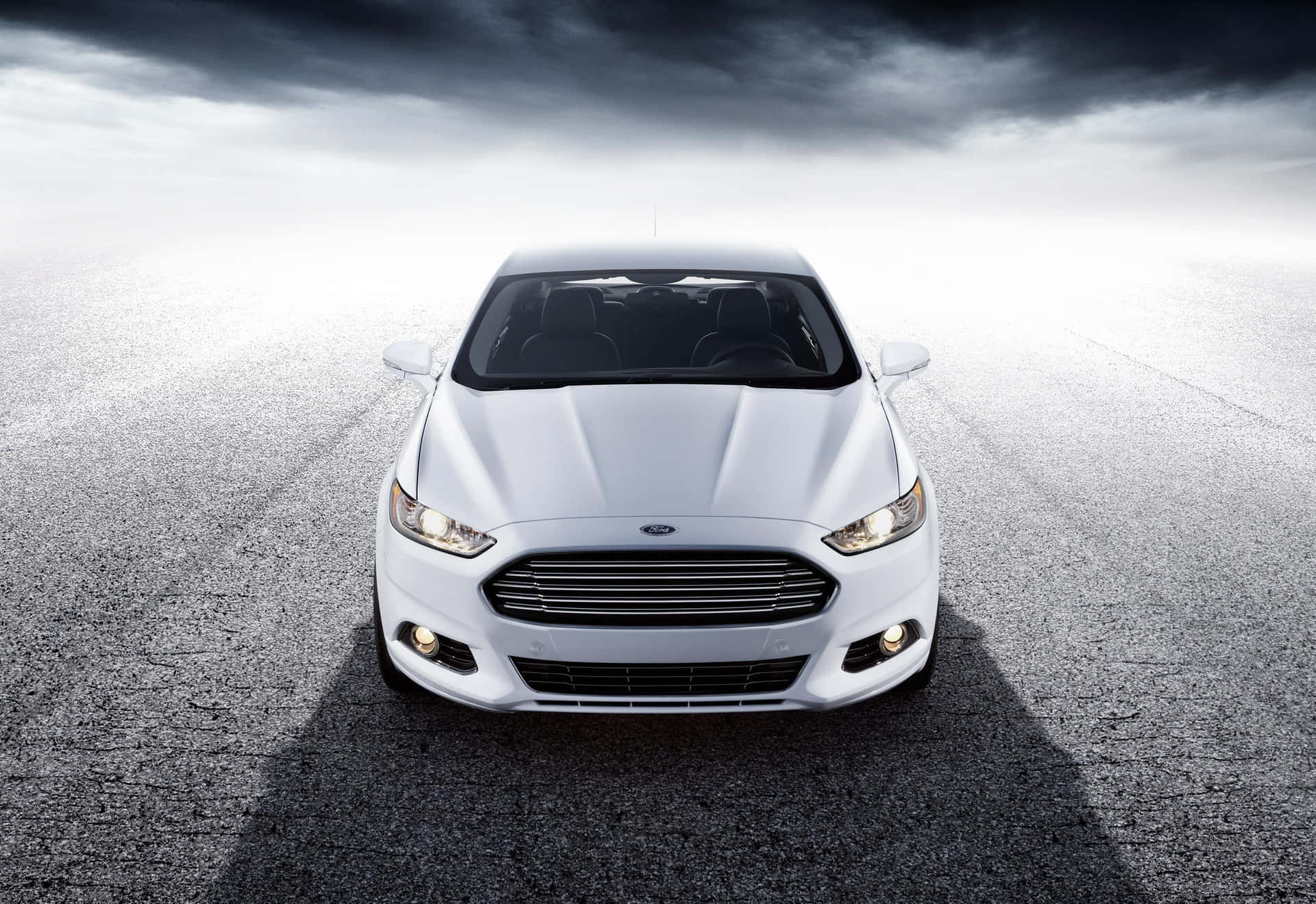 Caption: Sleek and Sophisticated Ford Fusion on the Road Wallpaper
