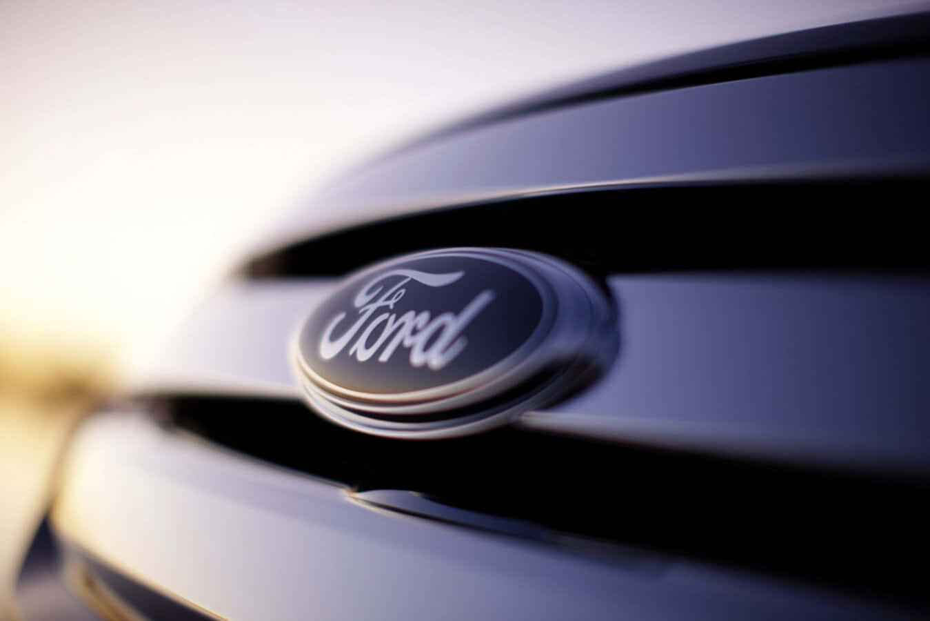 Ford Logo: Embodying Power and Performance Wallpaper