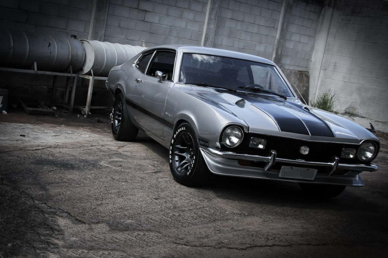 Sleek Ford Maverick parked on a scenic road Wallpaper