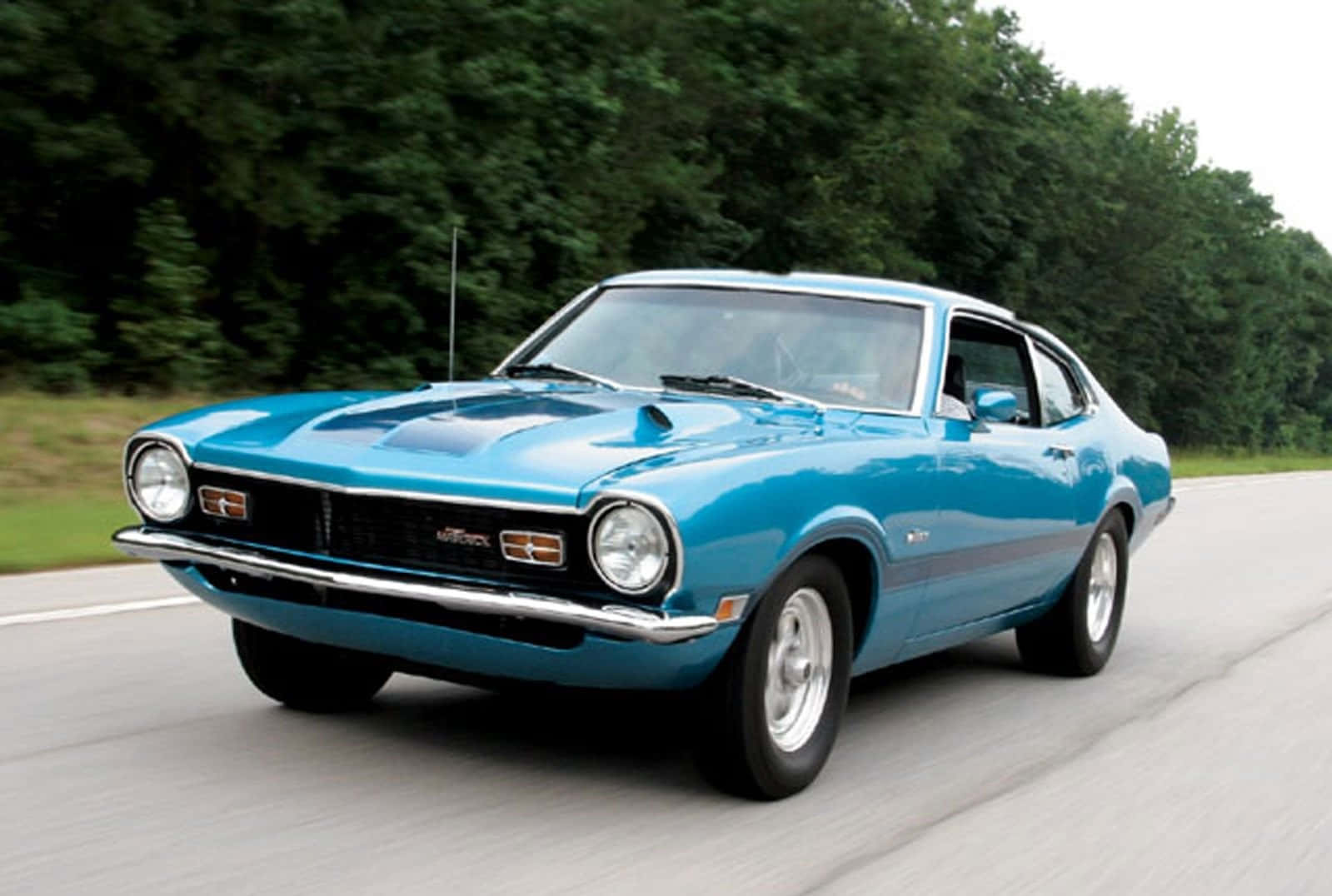 Sleek Ford Maverick in Scenic Landscape Wallpaper