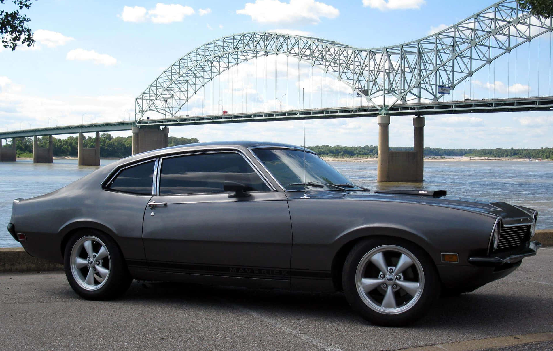 Sleek Ford Maverick Truck on a Scenic Road Wallpaper