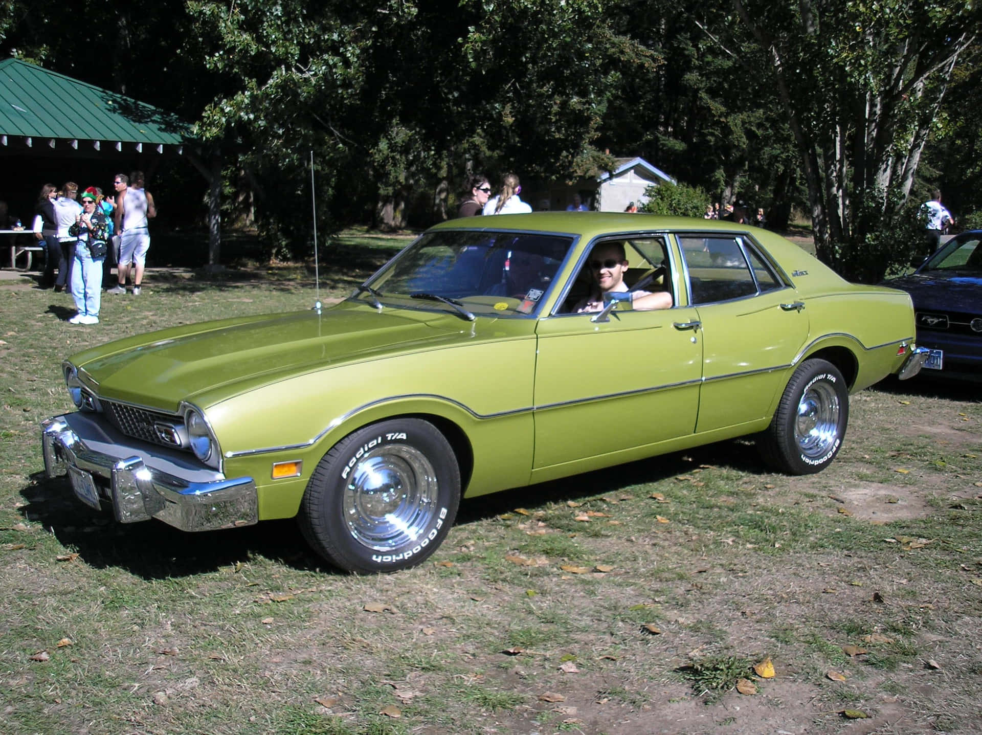 Ford Maverick Parked in a Picturesque Scenery Wallpaper