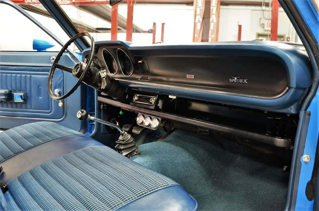 A Blue Interior Of A Classic Car