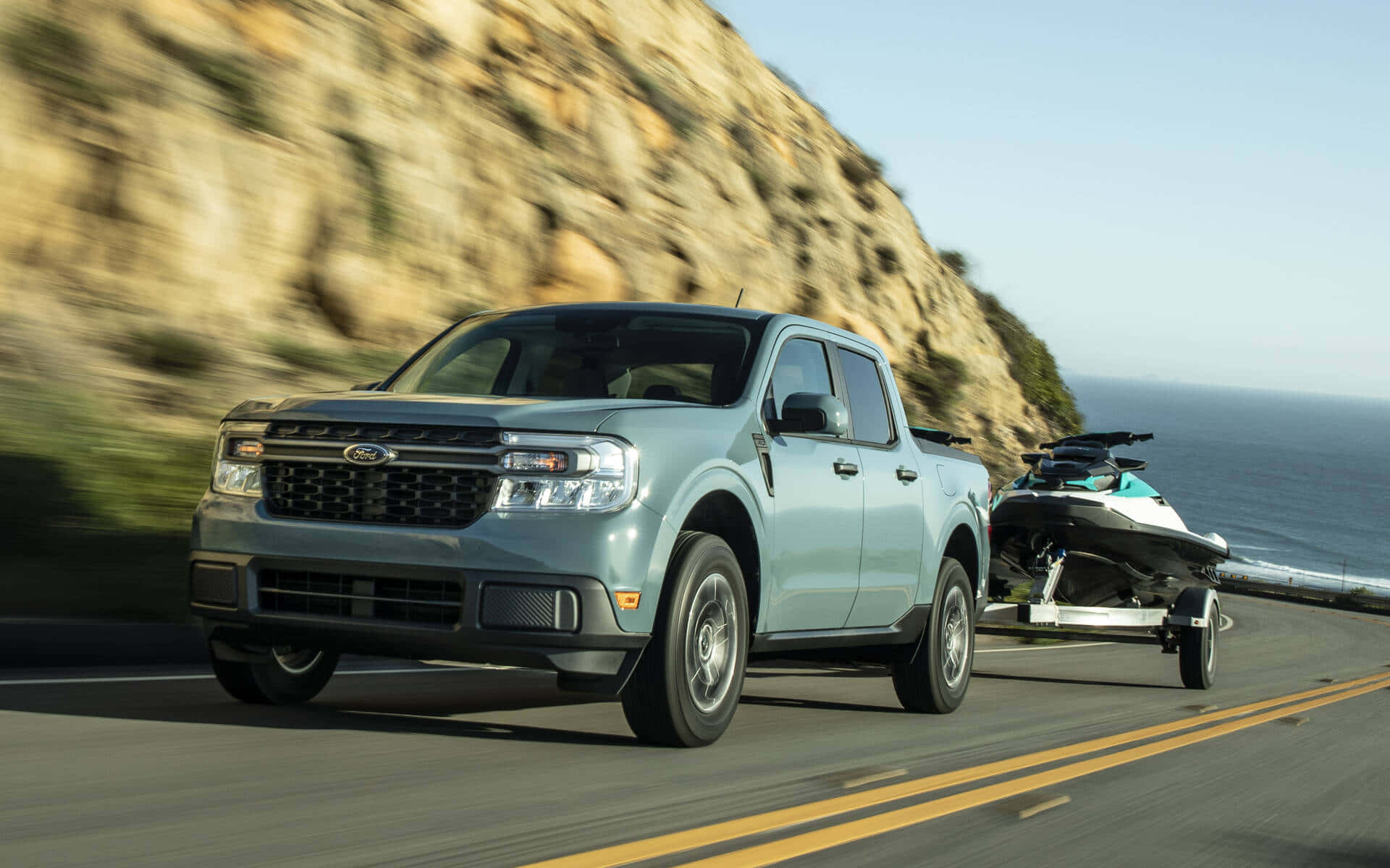 The 2020 Ford F-150 Is Towing A Boat On A Road