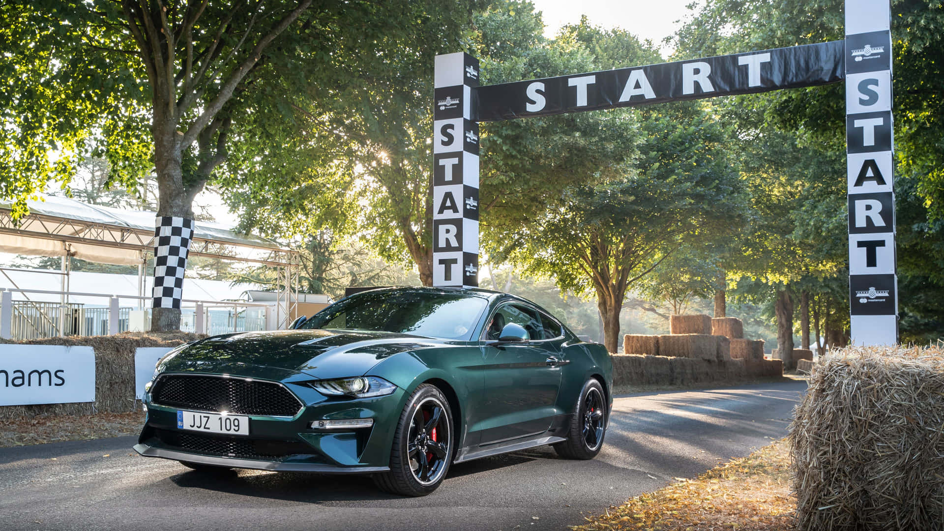 The Iconic Ford Mustang Bullitt Roaring on the Open Road Wallpaper