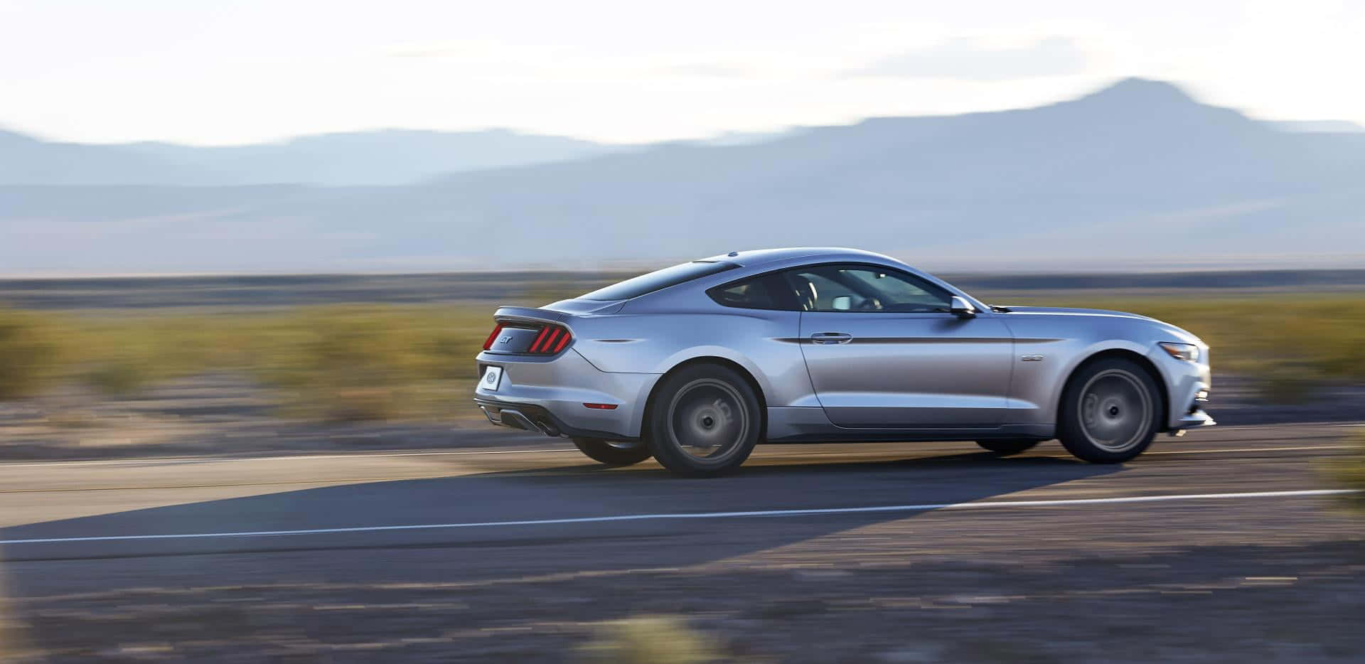 Stunning Ford Mustang California Special cruising on an open road Wallpaper